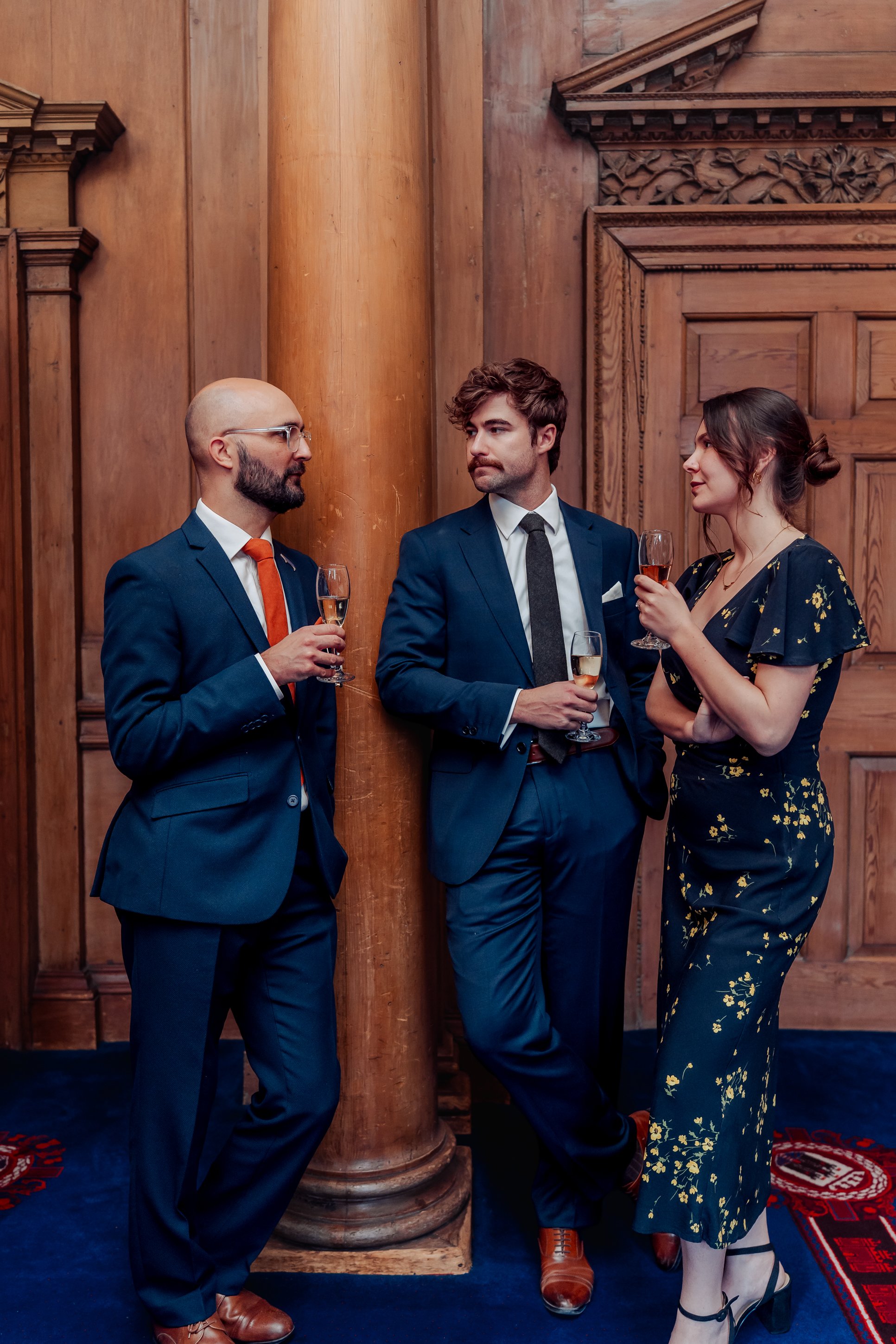 Family members and friends chatting after a wedding ceremony in Edinburgh