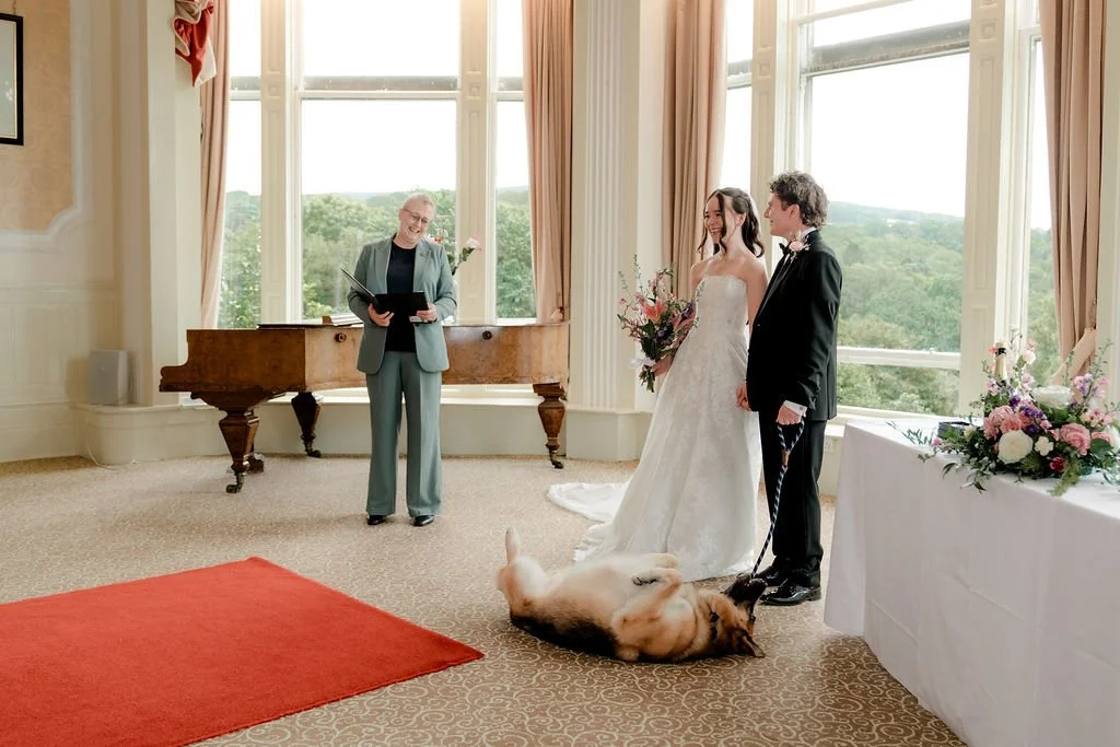 Bride and groom with their dog during an intimate wedding ceremony at Atholl Palace Hotel in Pitlochry, Scotland.
