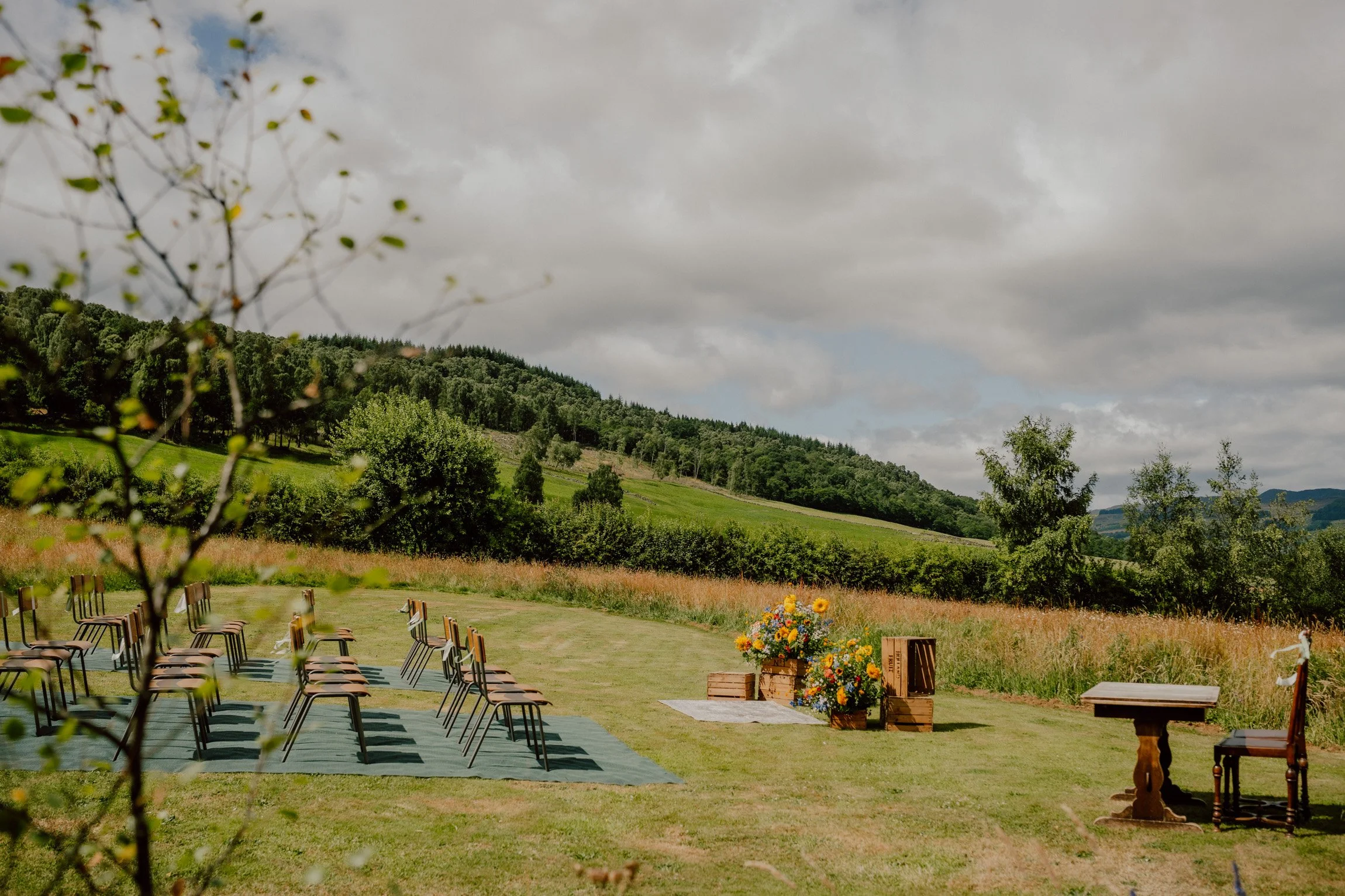 Outdoor ceremony setup on the meadows of Ballintaggart. Beautiful warm wedding venue photographed by patrice little photography