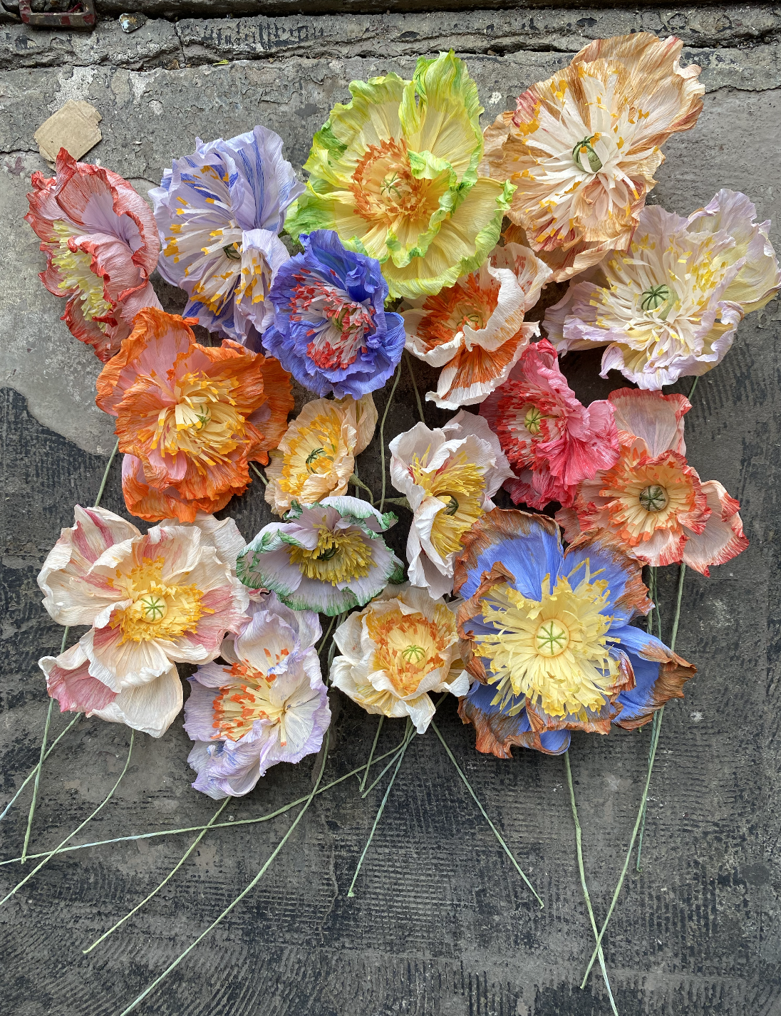 Multicoloured crepe paper poppies made using hand-dyed paper, Maggie Owen commission