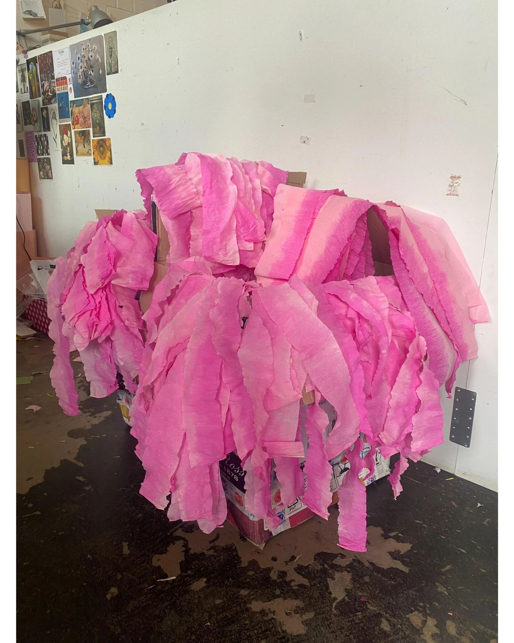 Large sculptural instalVibrant hand-dyed pink crepe paper, layered and draped in Emmeli Kimhi’s London studio