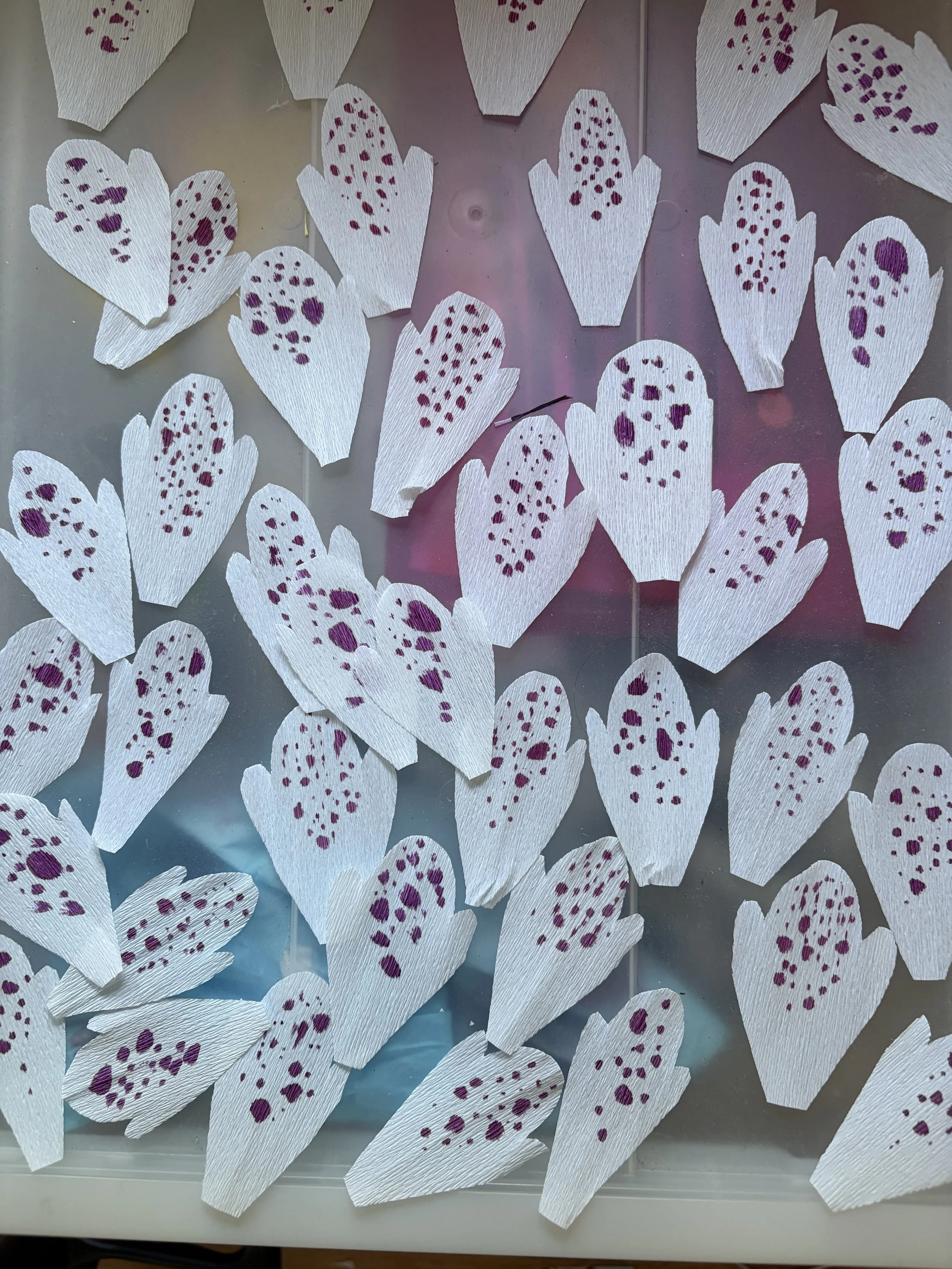 Hand-painted petals laid out to dry.