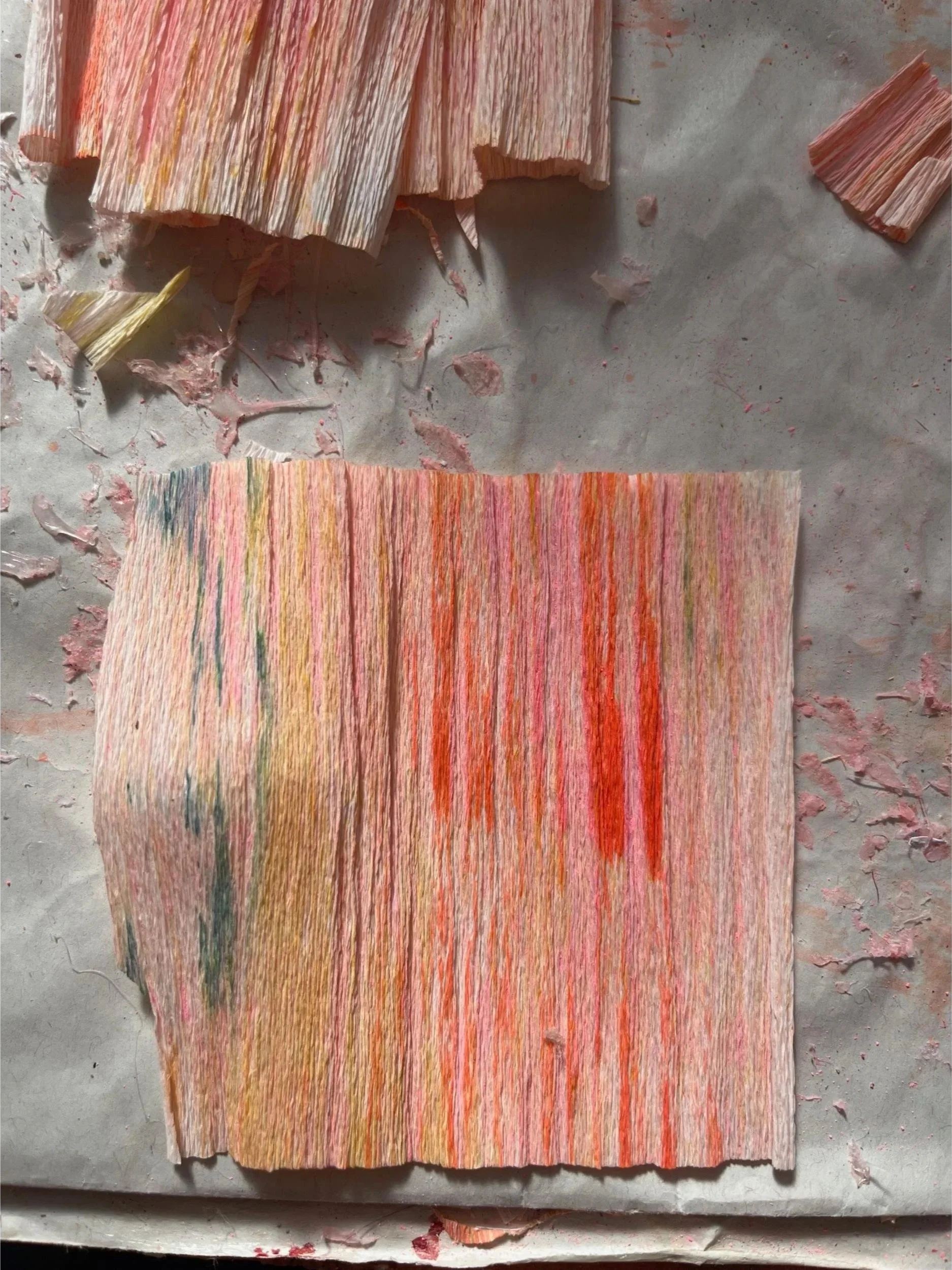 Hand-dyed crepe paper with streaky pink, orange, yellow and green tones using ink and watercolours, prepared for iris sculptures in the Completed Works x Matches collaboration by Emmeli Kimhi