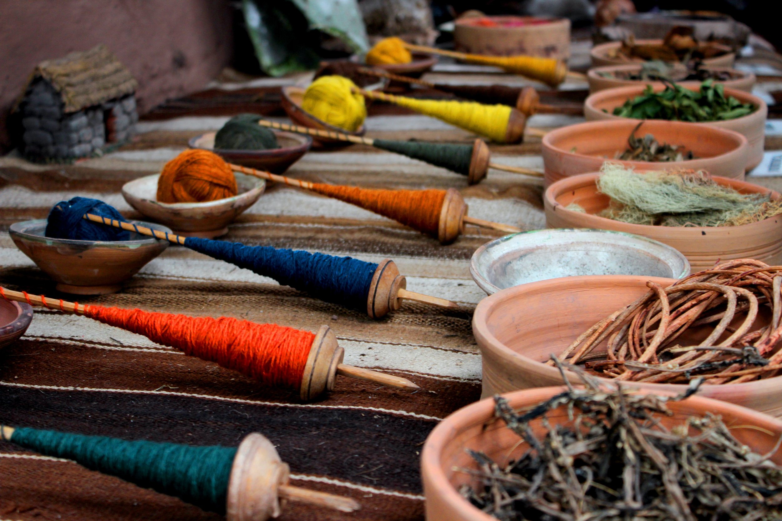 close up of different colored threads used by Chinchero weavers in Peru.jpg