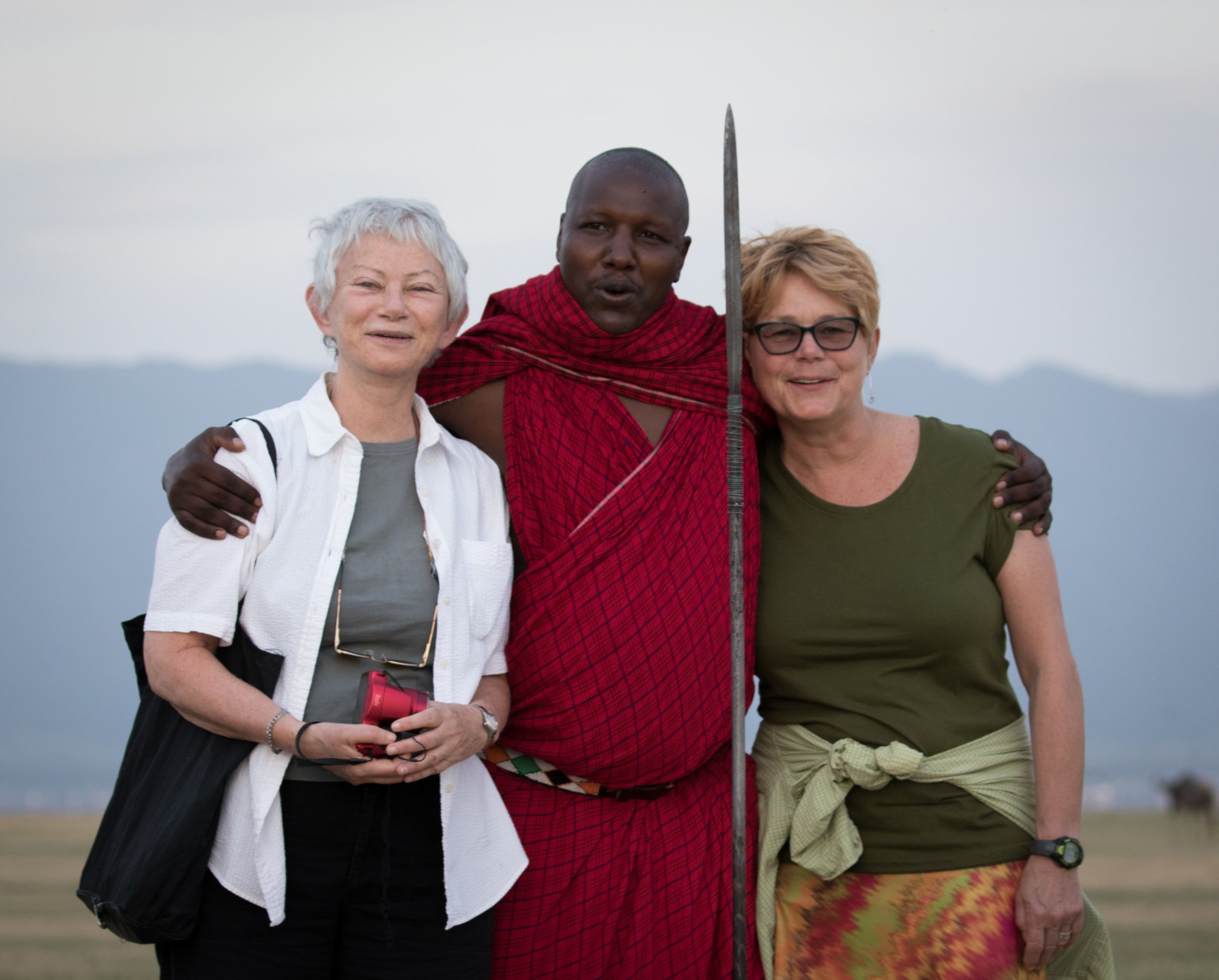 travelers with a Maasai man in Tanzania.jpg