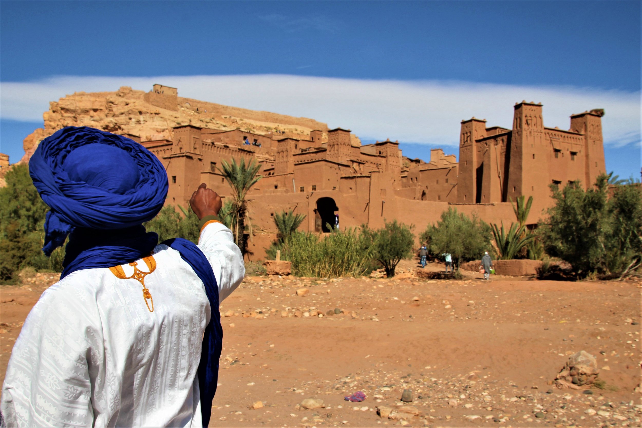 guide pointing out features of Ouarzazate in Morocco.jpg