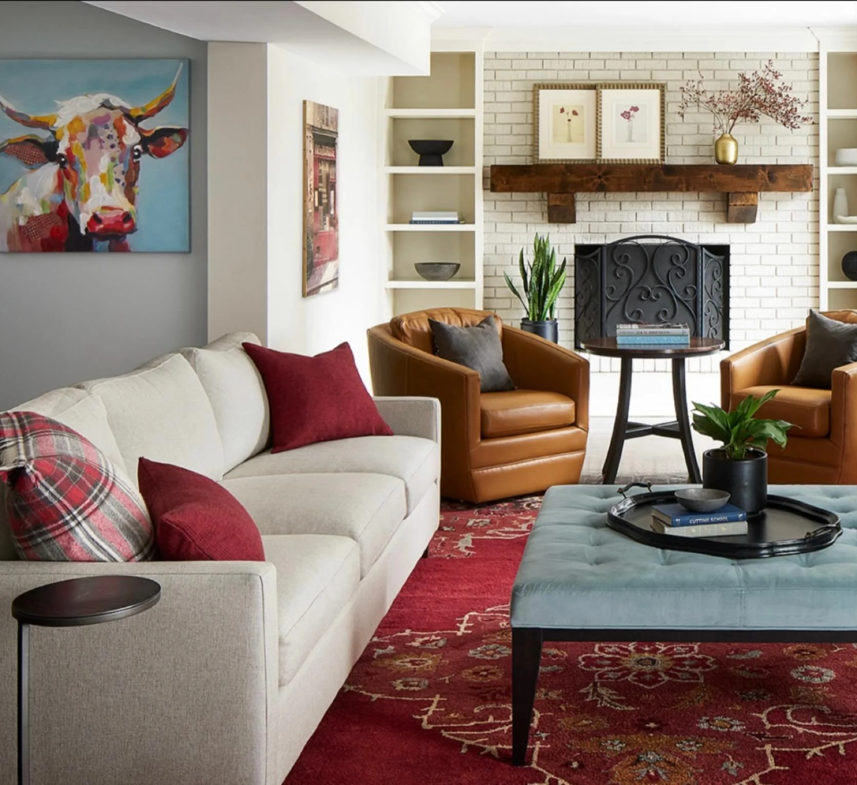 Why not decorate with red ALL year? &hearts;️💋&hearts;️ This family room in Clarendon Hills takes its cues from the area rug and sprinkles-in cognac and blue to pick up the colors in the client&rsquo;s beloved artwork. 
design - Inside Ideas Design 