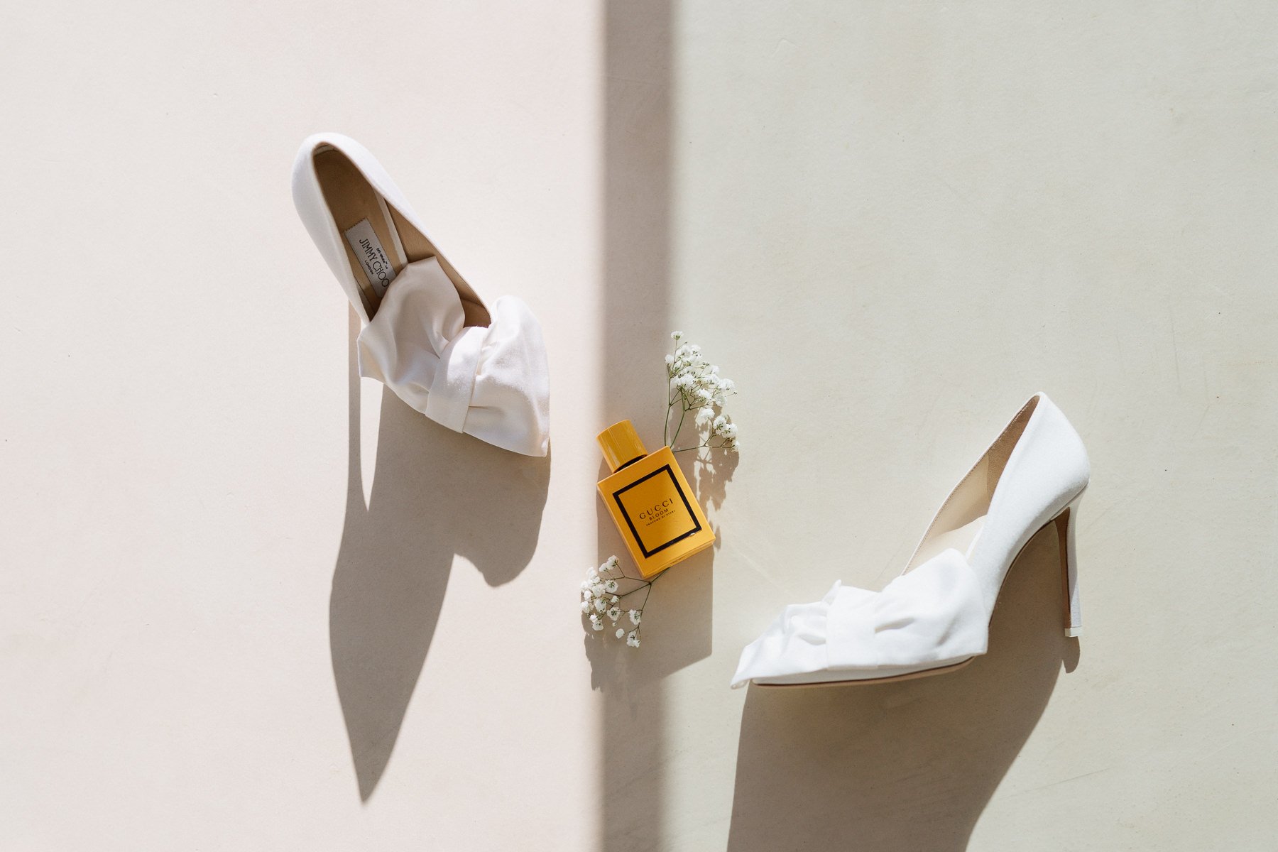 Luxury wedding details at Quinta do Pinho in Portugal, bridal shoes and perfume in natural light – photo Nonante Emotions.