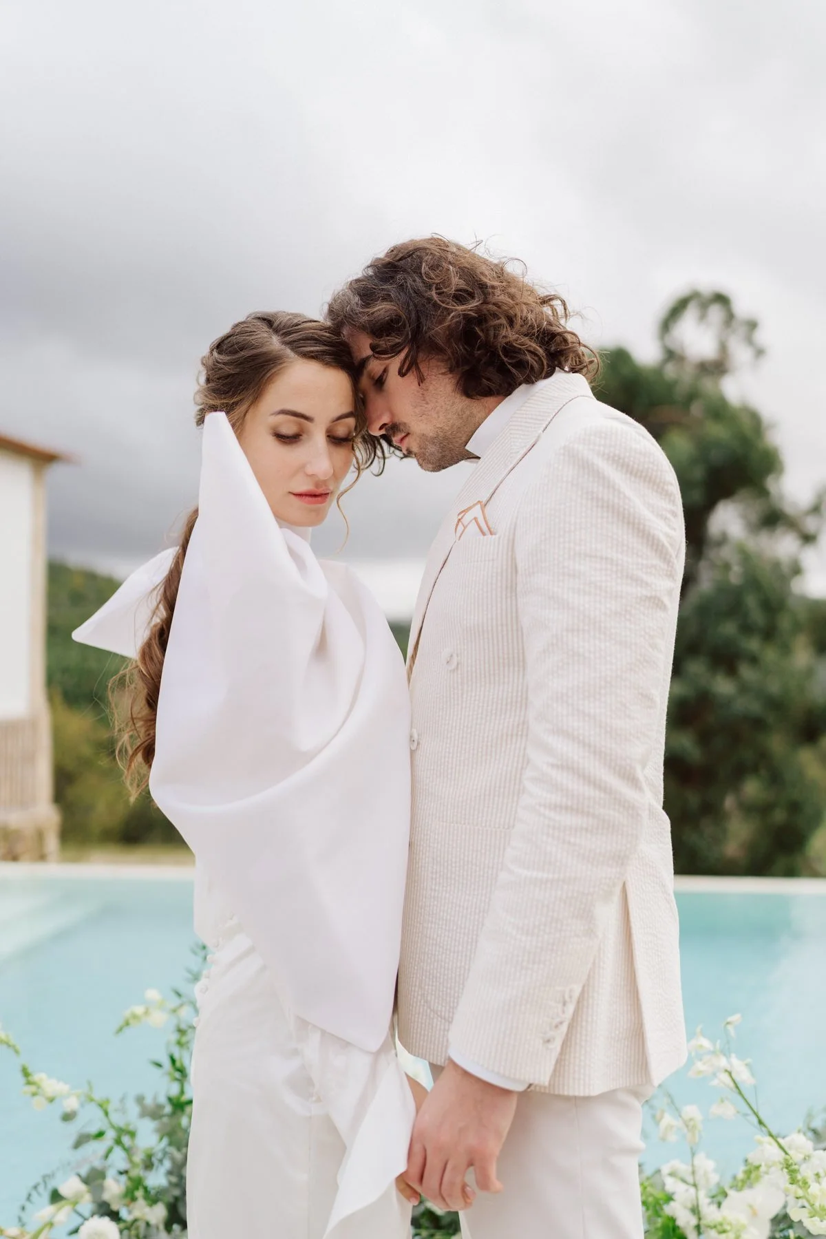 Intimate bride and groom portrait at Quinta do Pinho in Portugal – luxury destination wedding photography by the pool