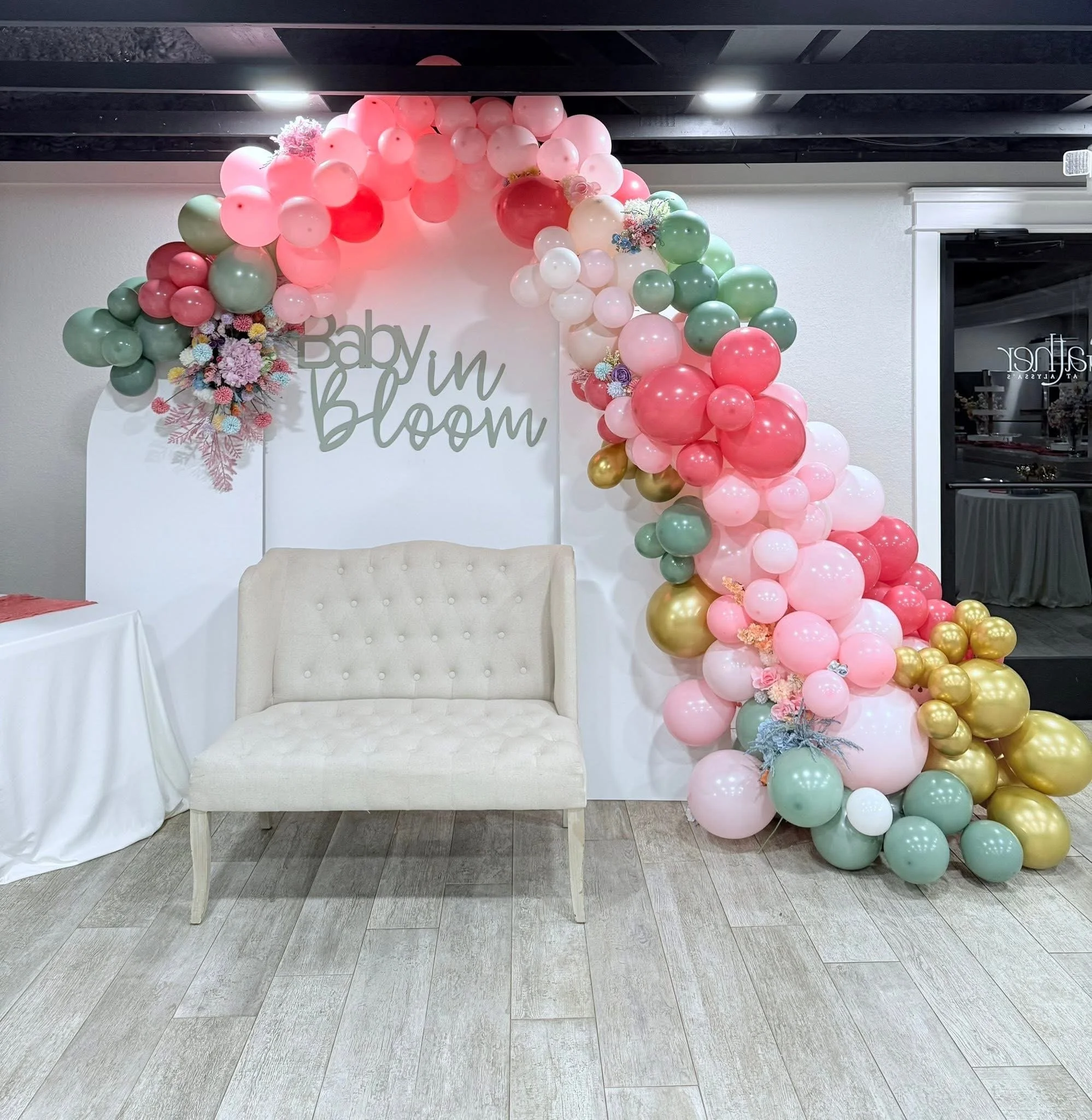 3 arch backdrop with balloon arch and wooden sign