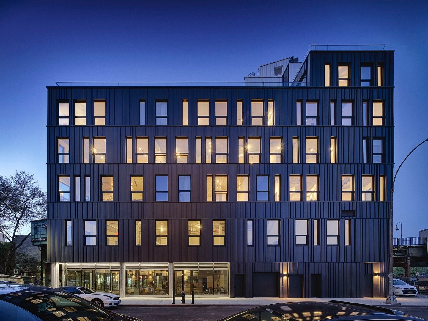 Williamsburg Multi Family is a 40,000 sf mixed-use building clad in black standing seam aluminum which creates a texture of shadow lines punctured by an irregular rhythm of windows. 

📸 @carbone 

#mixedusedevelopment #multifamily #nycarchitecture #