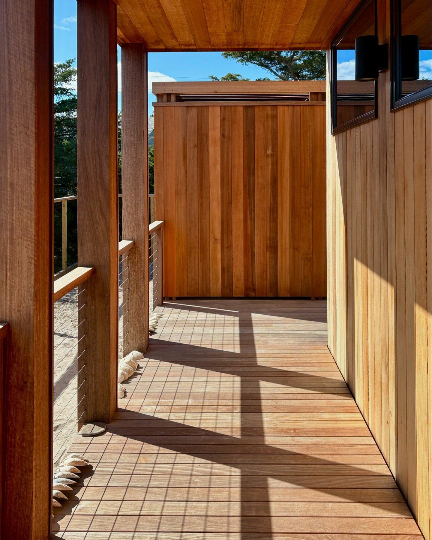 Our #newconstruction design- Champlain House finished in time for the summer. The outdoor shower beyond is in proportion to the void created at the recessed main entrance.

#beachhouse #modernbeachhouse #modernarchitecture #architecturelovers #cedars