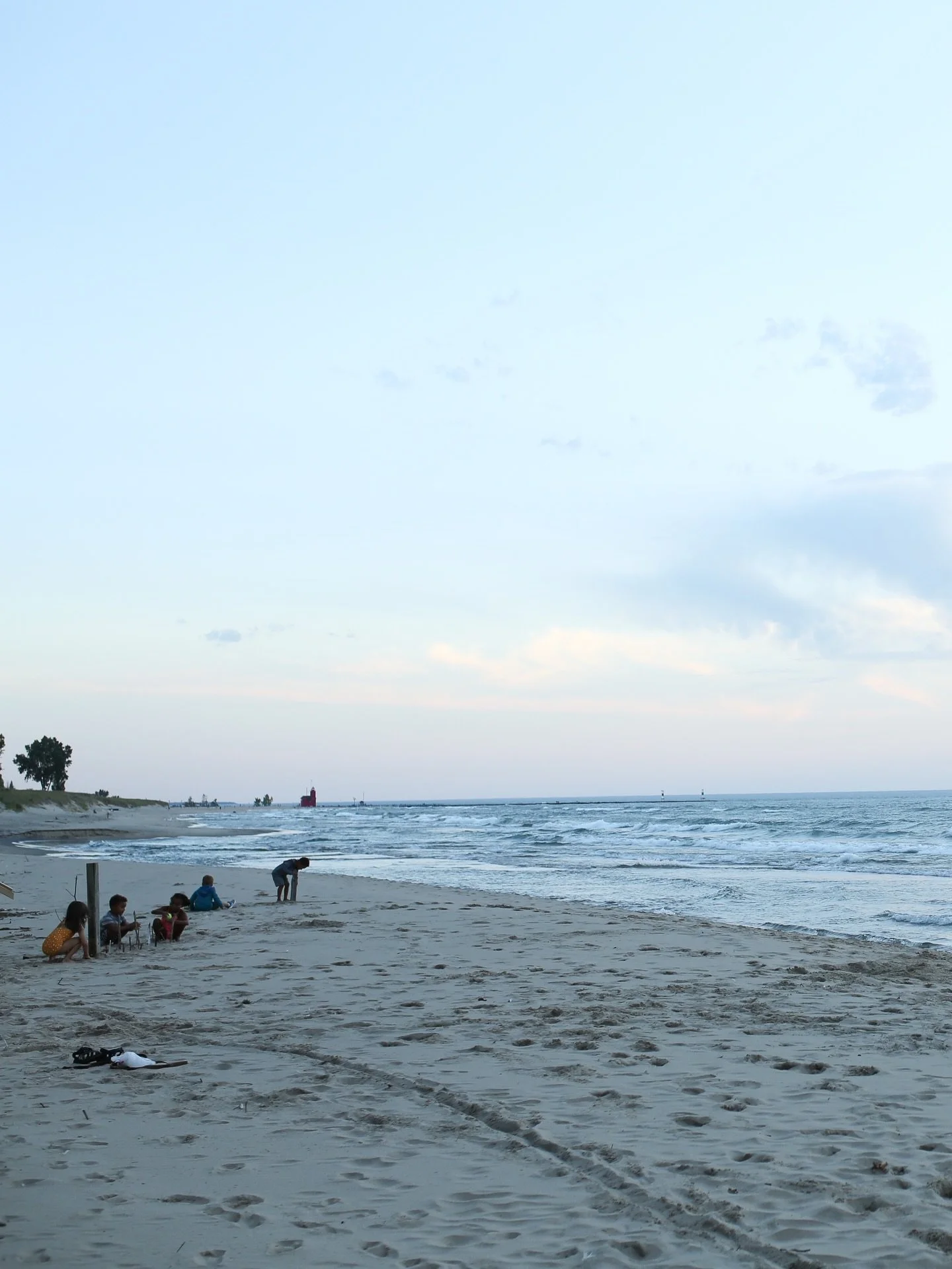 I was going through photos this weekend and came across this shot from four summers ago. It&rsquo;s the end of the day, at the end of summer, and all five kids are deep into beach projects. Our dog Rosie is in her element and Big Red is looking out o