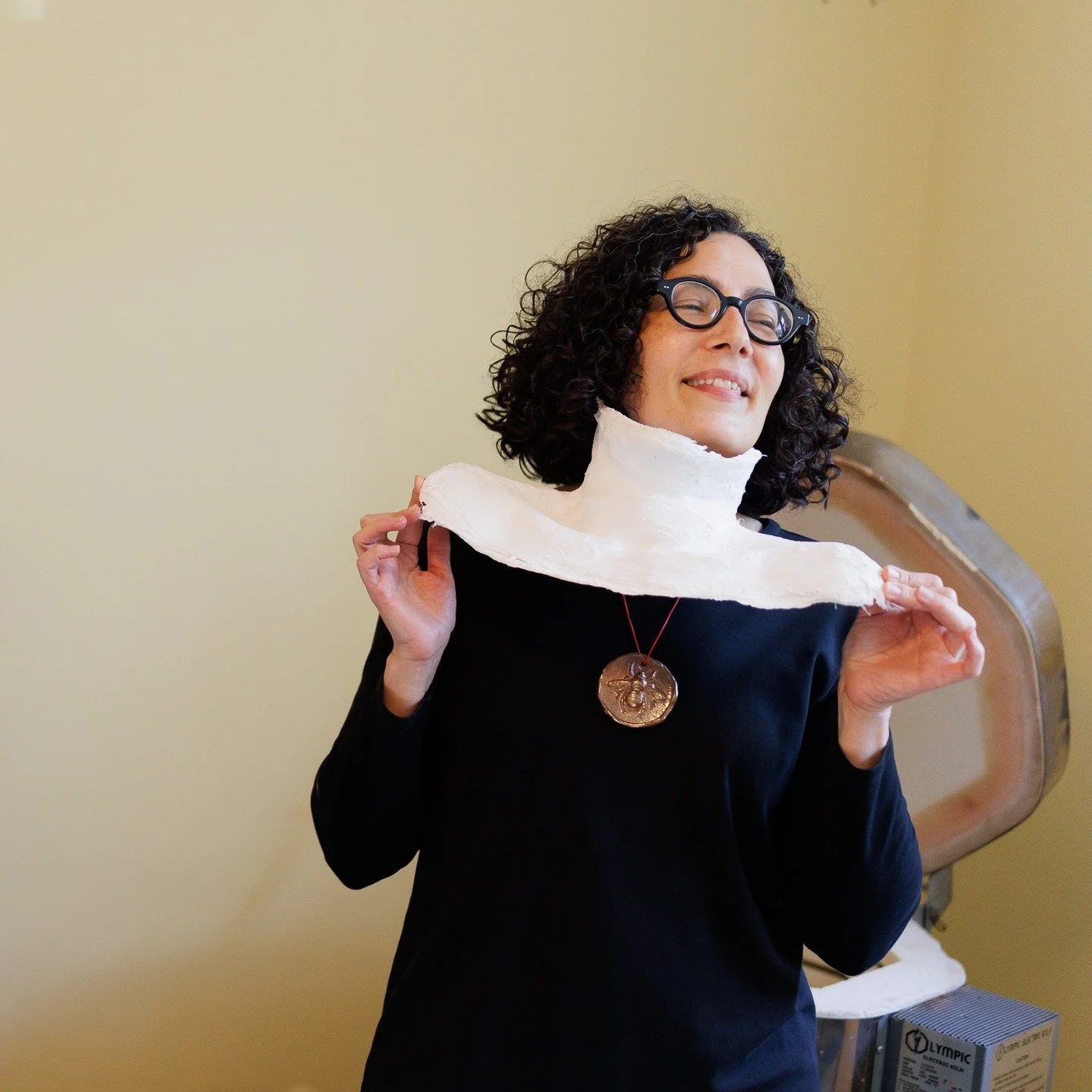 Here I am posing with my sculpture, God Is Closer to You Than Your Jugular Vein, which is a Quranic quote. I wrote a talk back poem to accompany the sculpture, about a former boss who was a bigot. The poem tells the story of how my socially engaged p