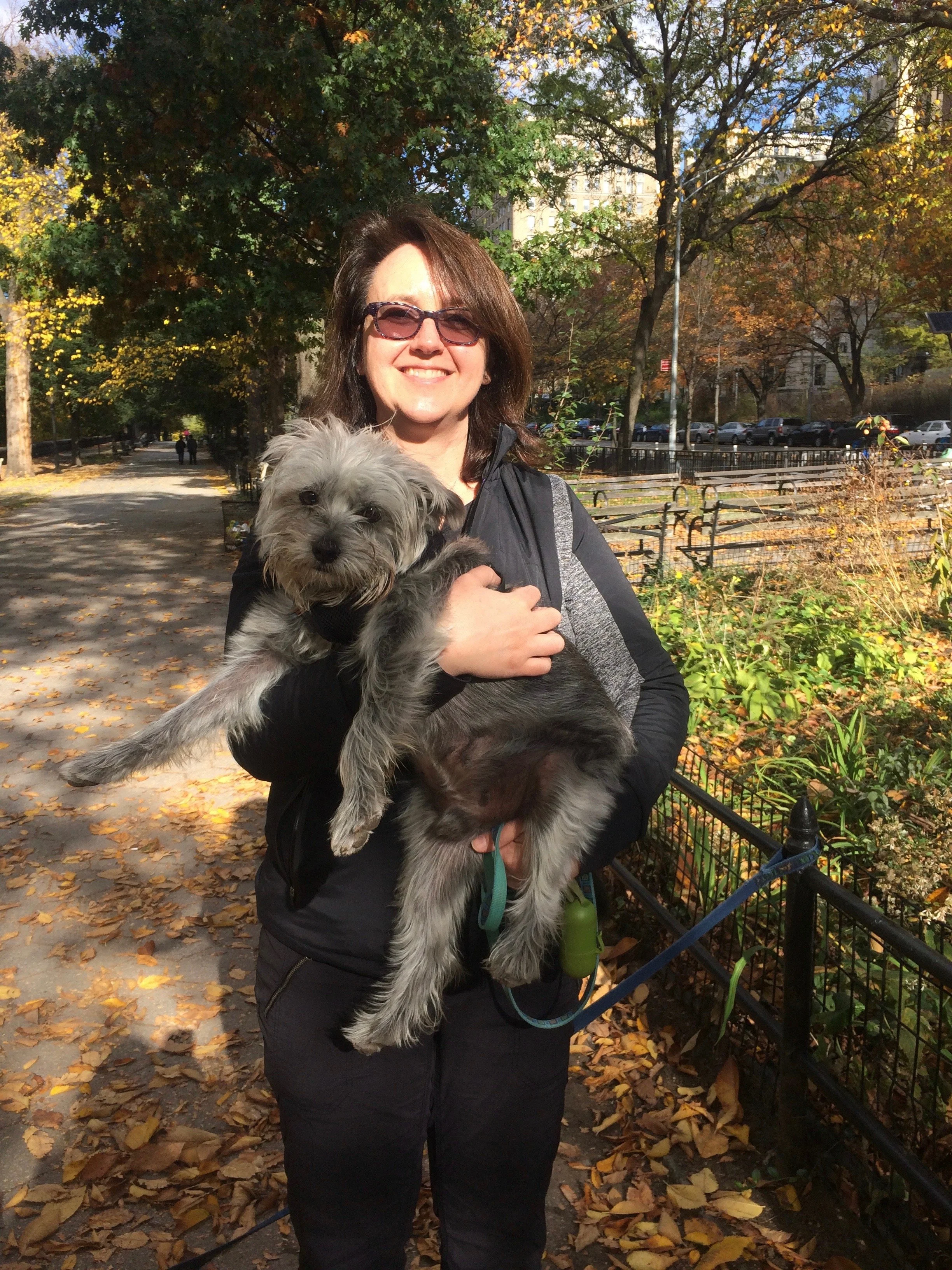 Copy editor Laura Bronson holding her dog Ozzie Bear, the original good bear