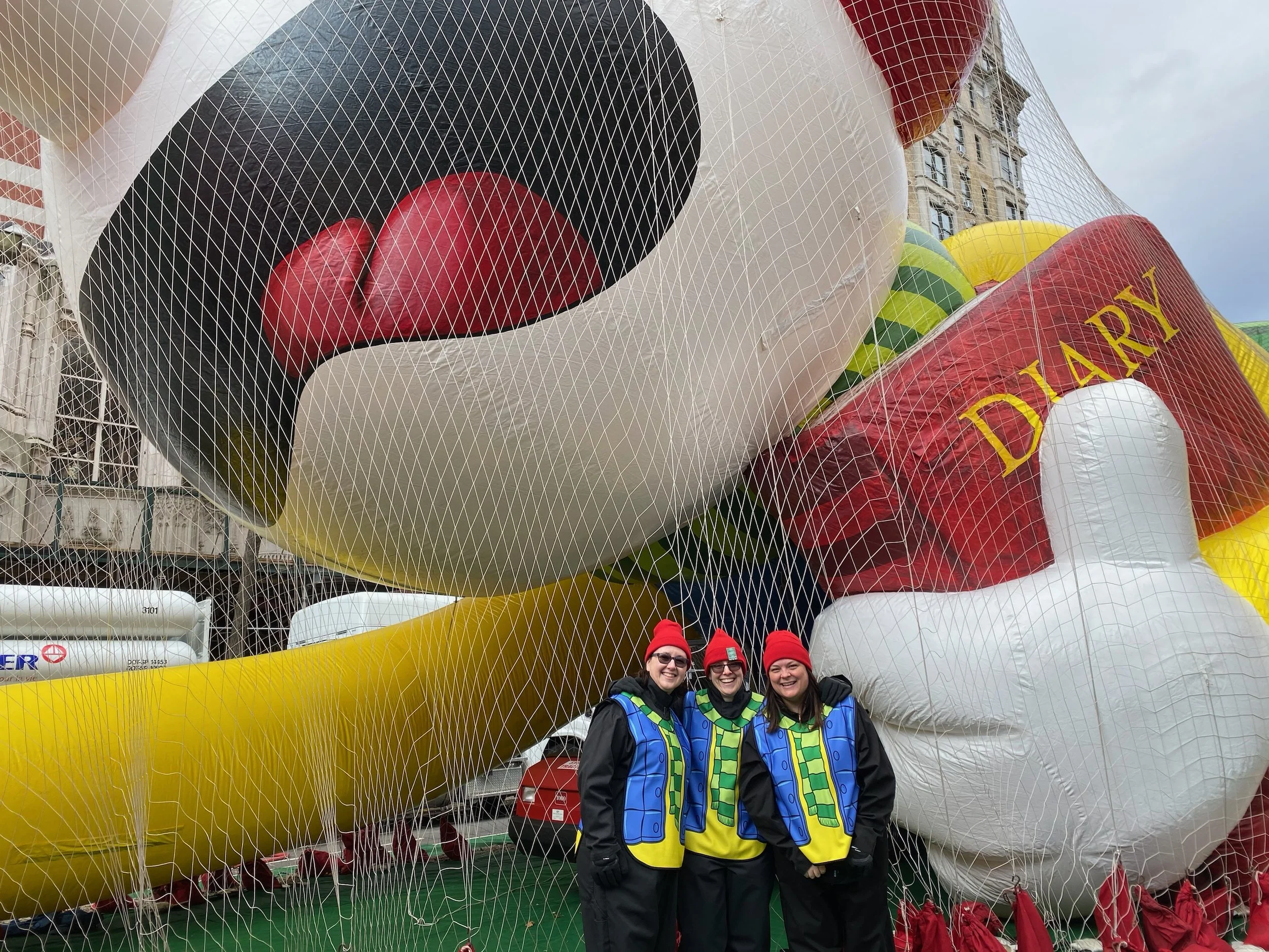 Diary of a Wimpy Kid balloon  held down by netting before the Macy's Thanksgiving Parade
