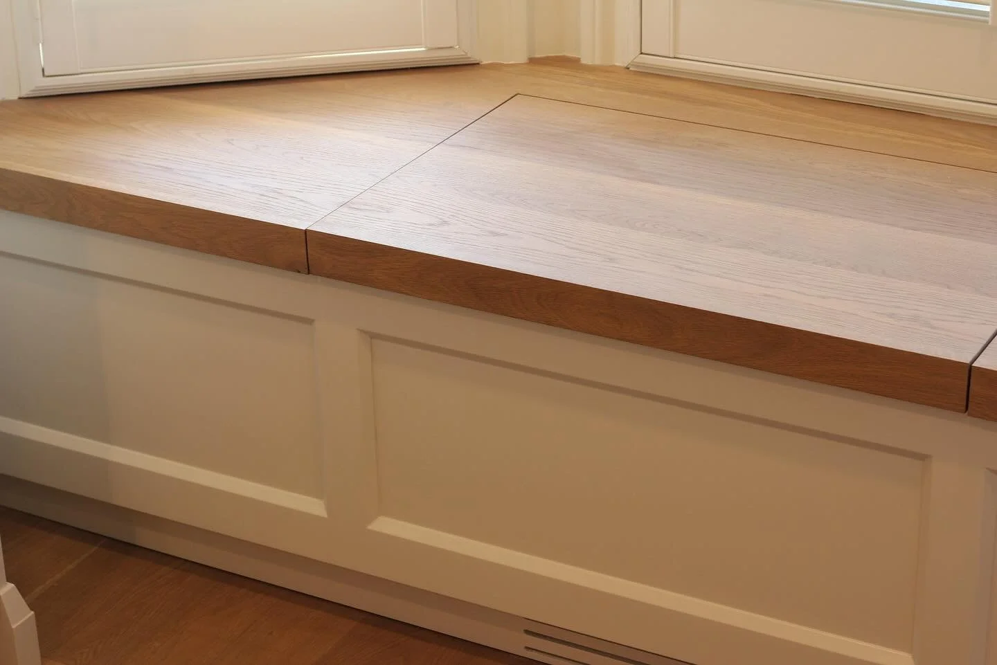 White oak bay window bench with storage designed, built and installed in-house. 

We used an @osmocanada wood wax finish to colour match the hardwood flooring and made a shaker panel in house to match the style of the kitchen cabinets. 

A fun projec