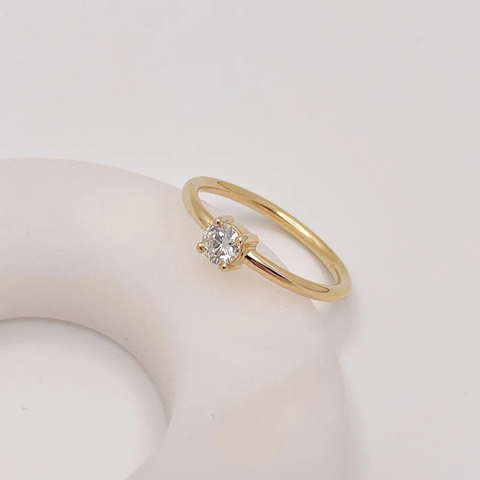 modern solitaire engagement ring in recycled gold and a lab grown diamond