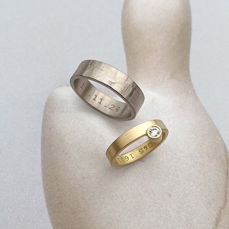 Original wedding rings crafted in recycled ethical gold. Hers with an externally set lab diamond