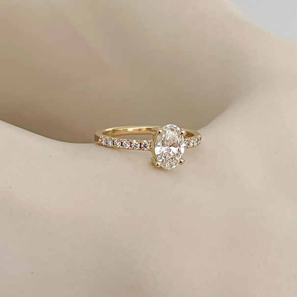 Eternity engagement ring with large oval diamond. Handcrafted by De Vree.