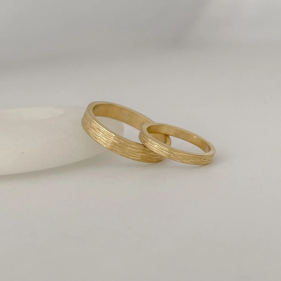 Matching textured wedding bands in Antwerp