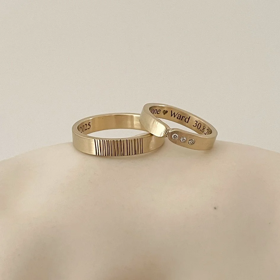 Modern wedding bands with a textured finish, handmade in Antwerp from 14-karat yellow gold by jeweler De Vree
