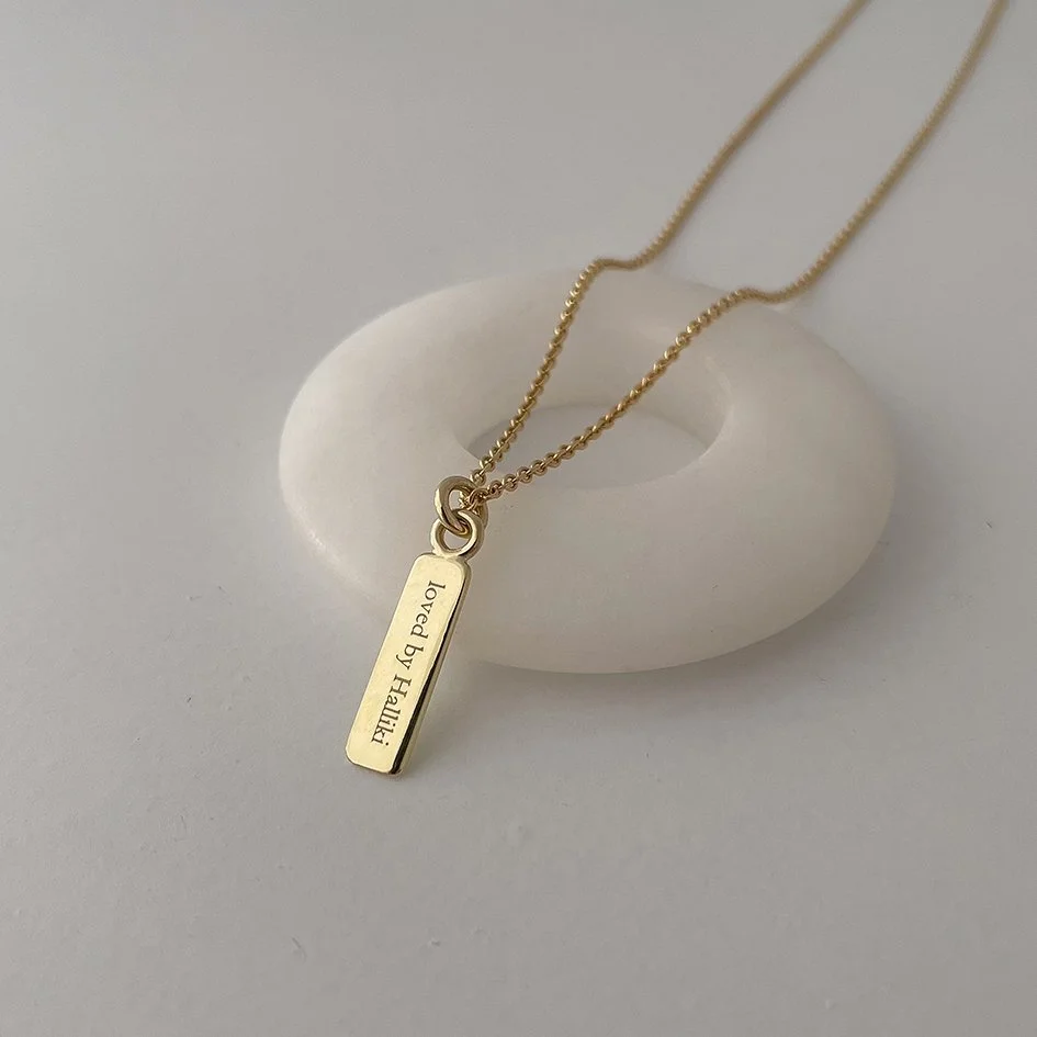 A modern alternative to a wedding ring. Since the man couldn't wear a wedding ring, we designed this unique pendant.