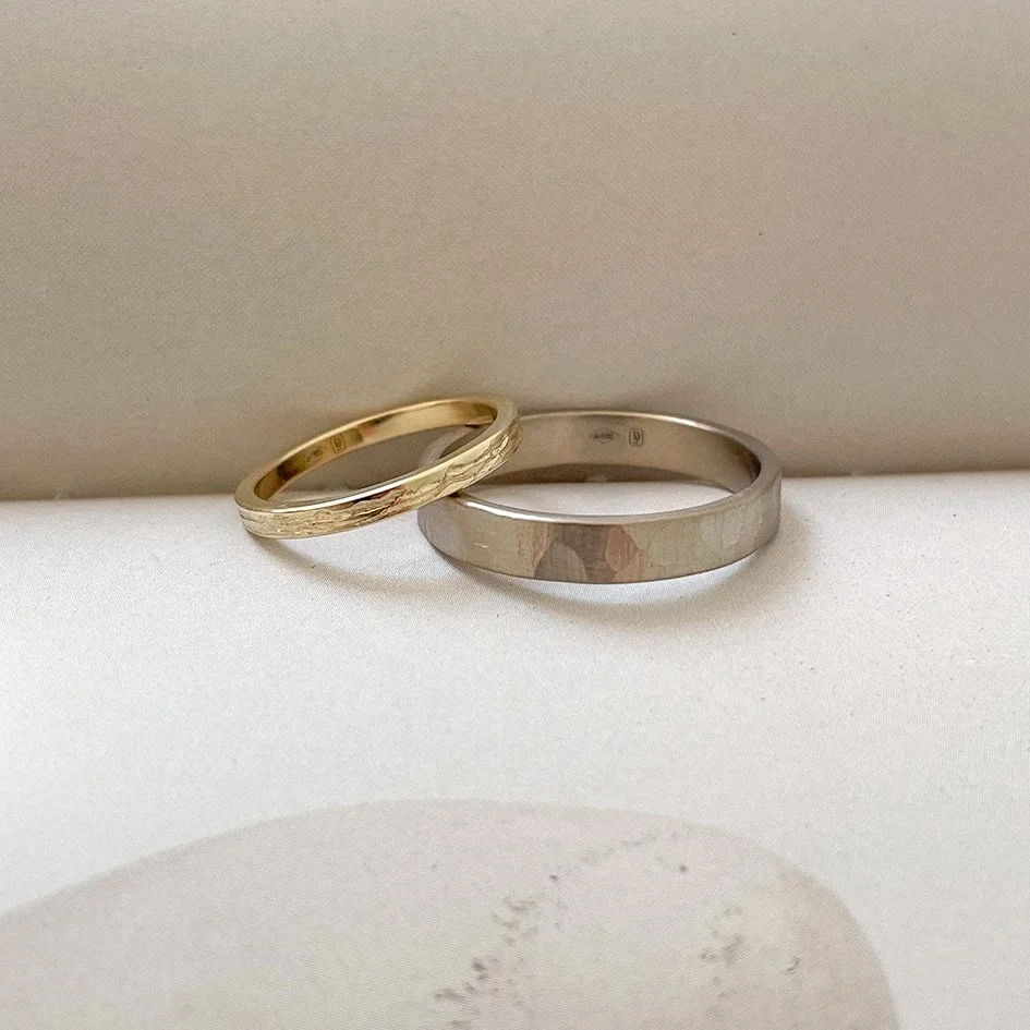 White gold and yellow gold wedding bands, ethically crafted by goldsmith De Vree in Antwerp.