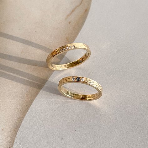 structured wedding rings in recycled gold with small diamonds, crafted in antwerp