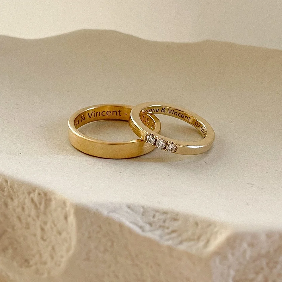 A matching set of simple diamond wedding bands for her
