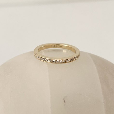 Modern eternity wedding ring with small rail set lab diamonds