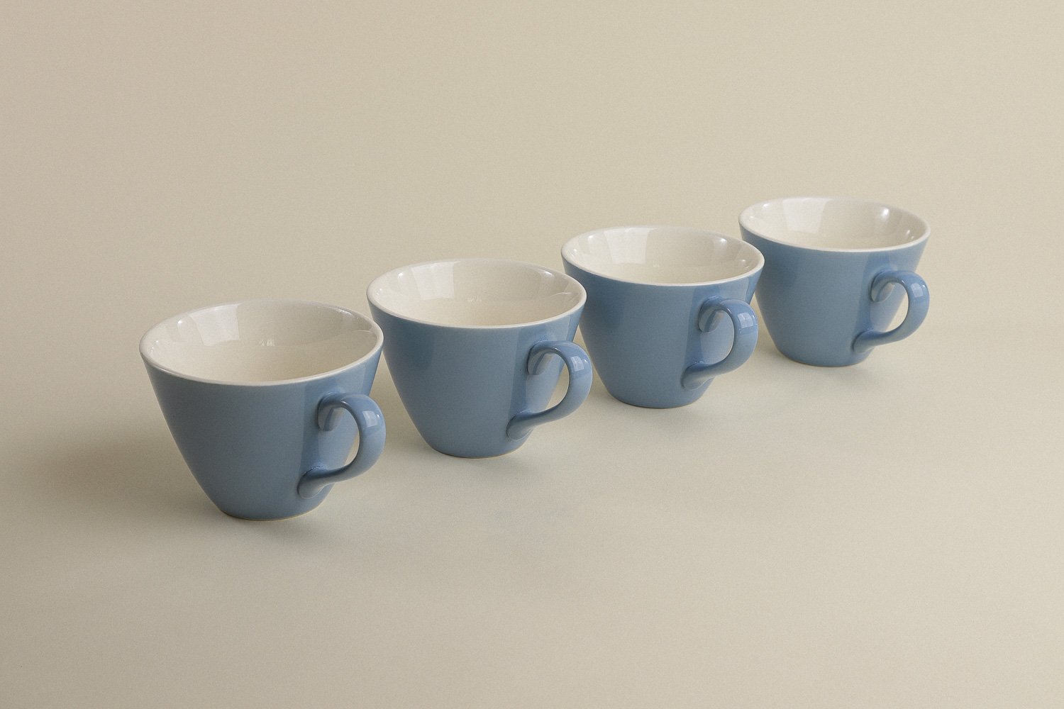 Set (4) of vintage mid-century teacups in a beautiful shade of sky blue with white interiors.