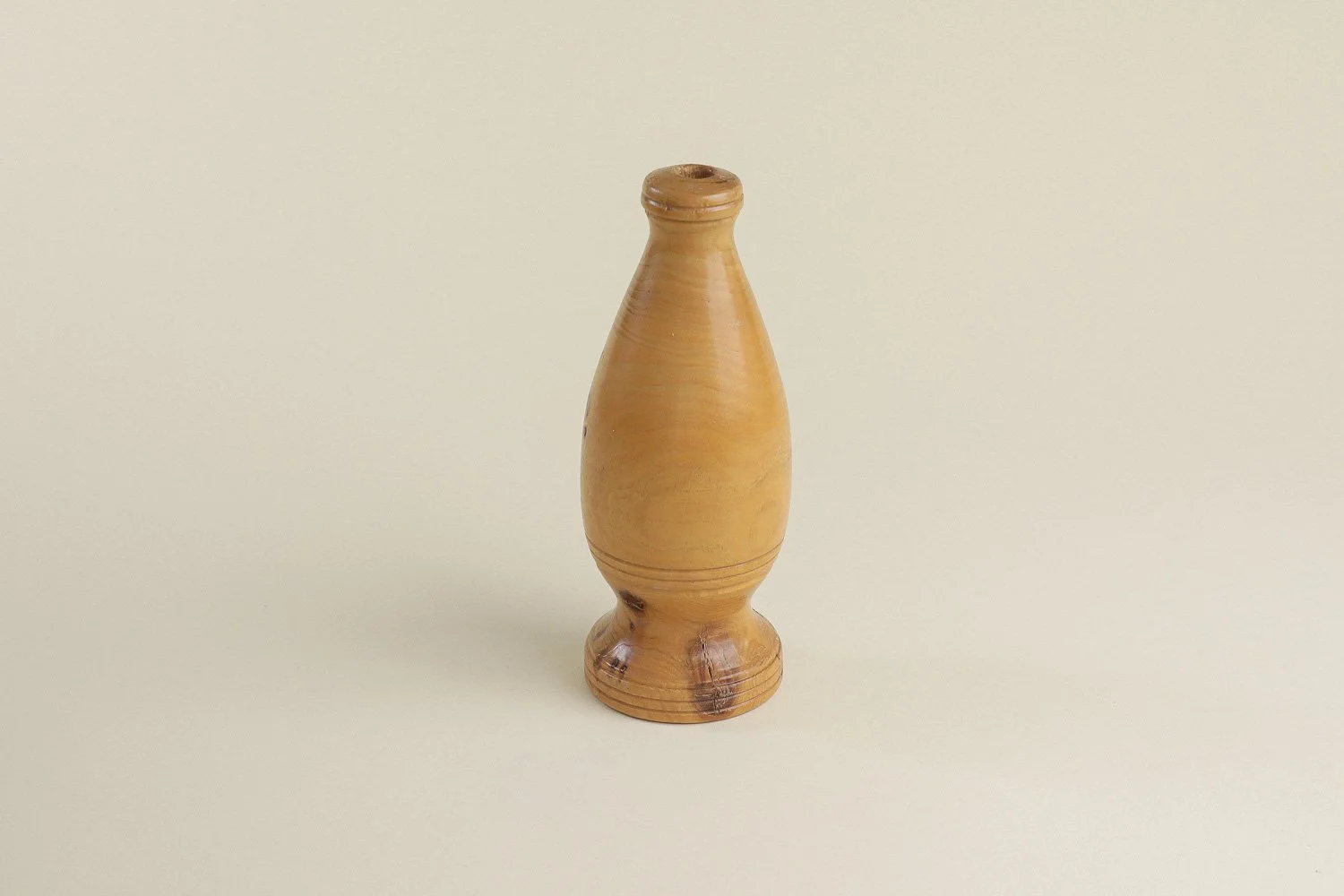 Vintage hand-turned spruce wood bud vase. Signed on the bottom by the maker R. Cooper, dated 3/10/96.