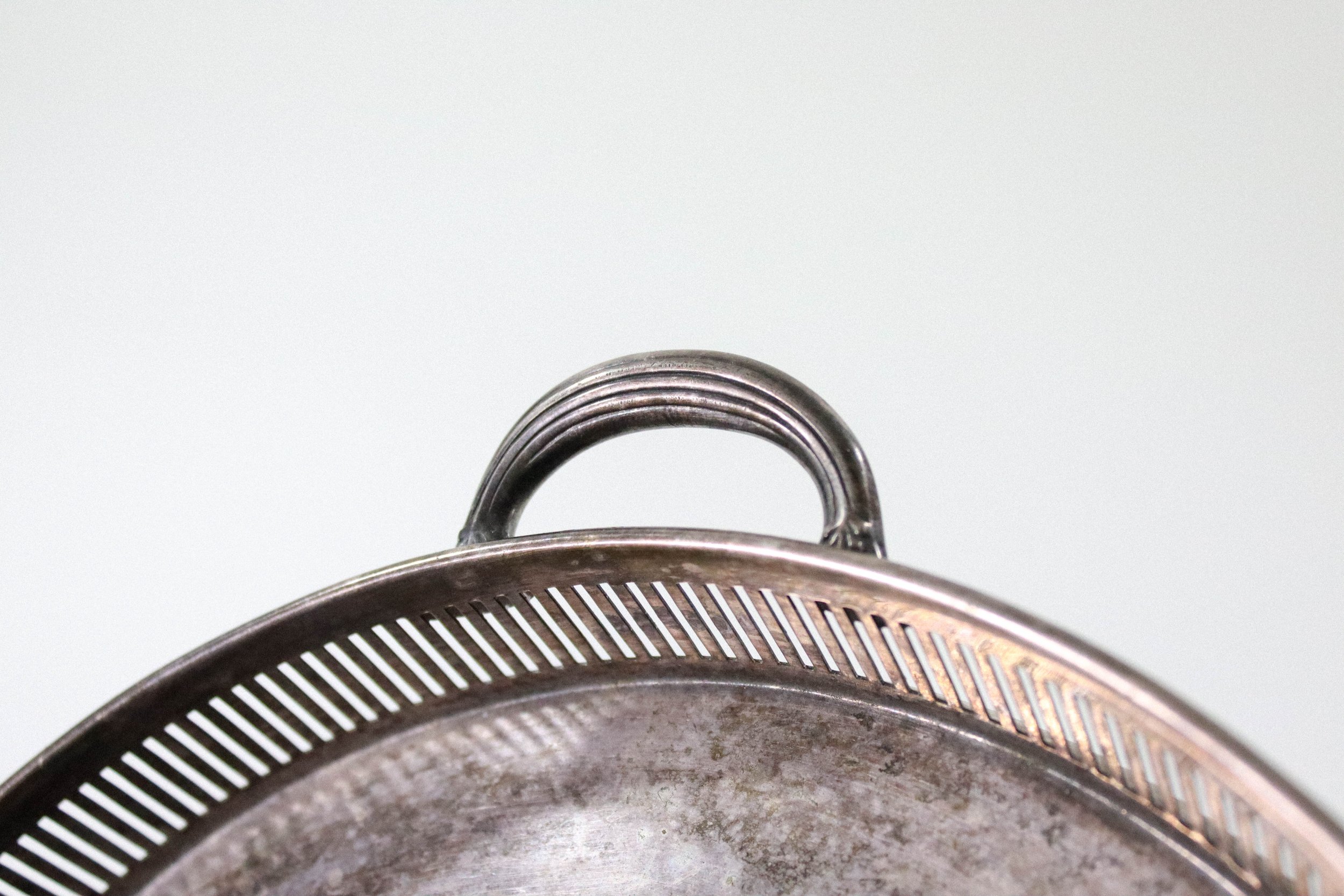Vintage Reed & Barton round silver tray with handles.