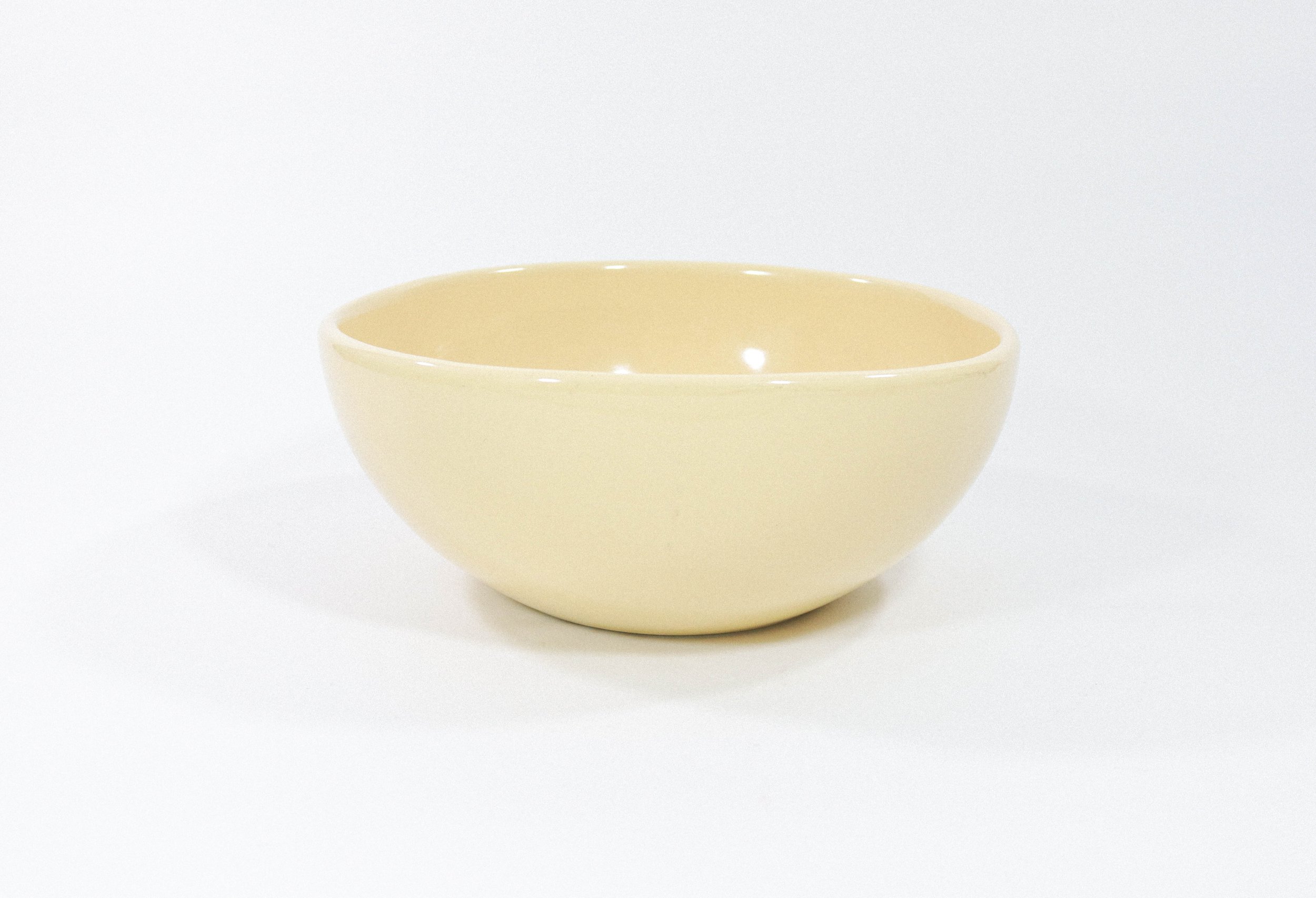 Large and hefty pale yellow ceramic bowl by American Ceramics Inc in Phoenix, Arizona