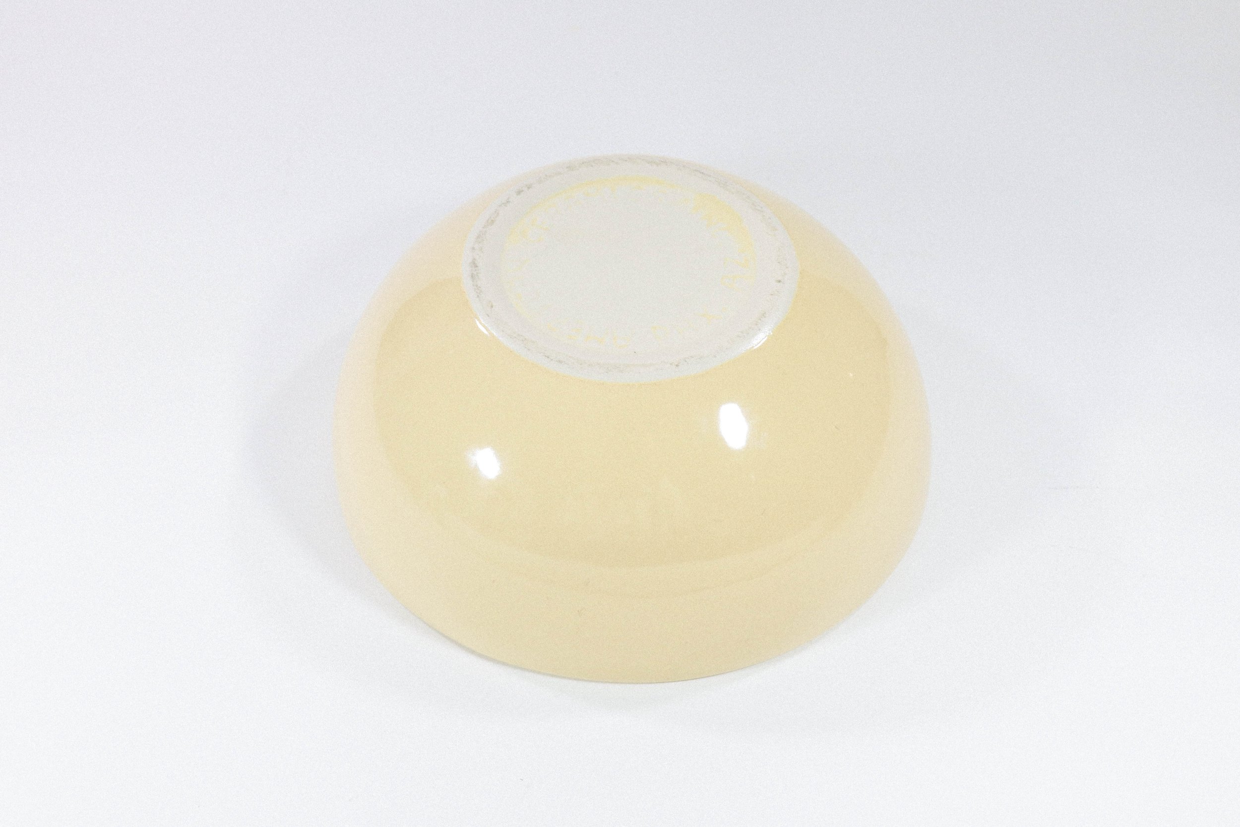 Large and hefty pale yellow ceramic bowl by American Ceramics Inc in Phoenix, Arizona