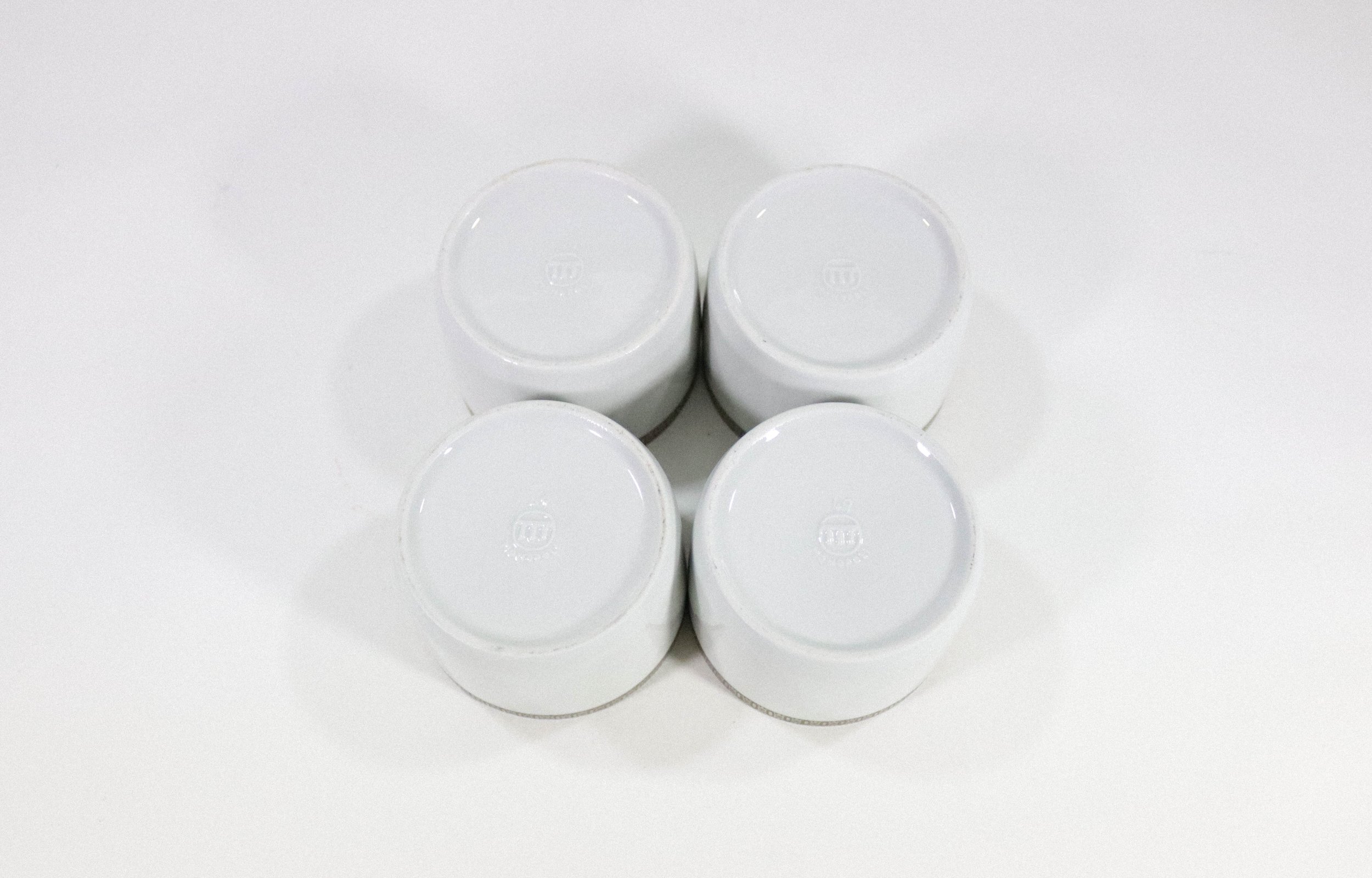 Set (4) of vintage Monopoli silver and porcelain cups.