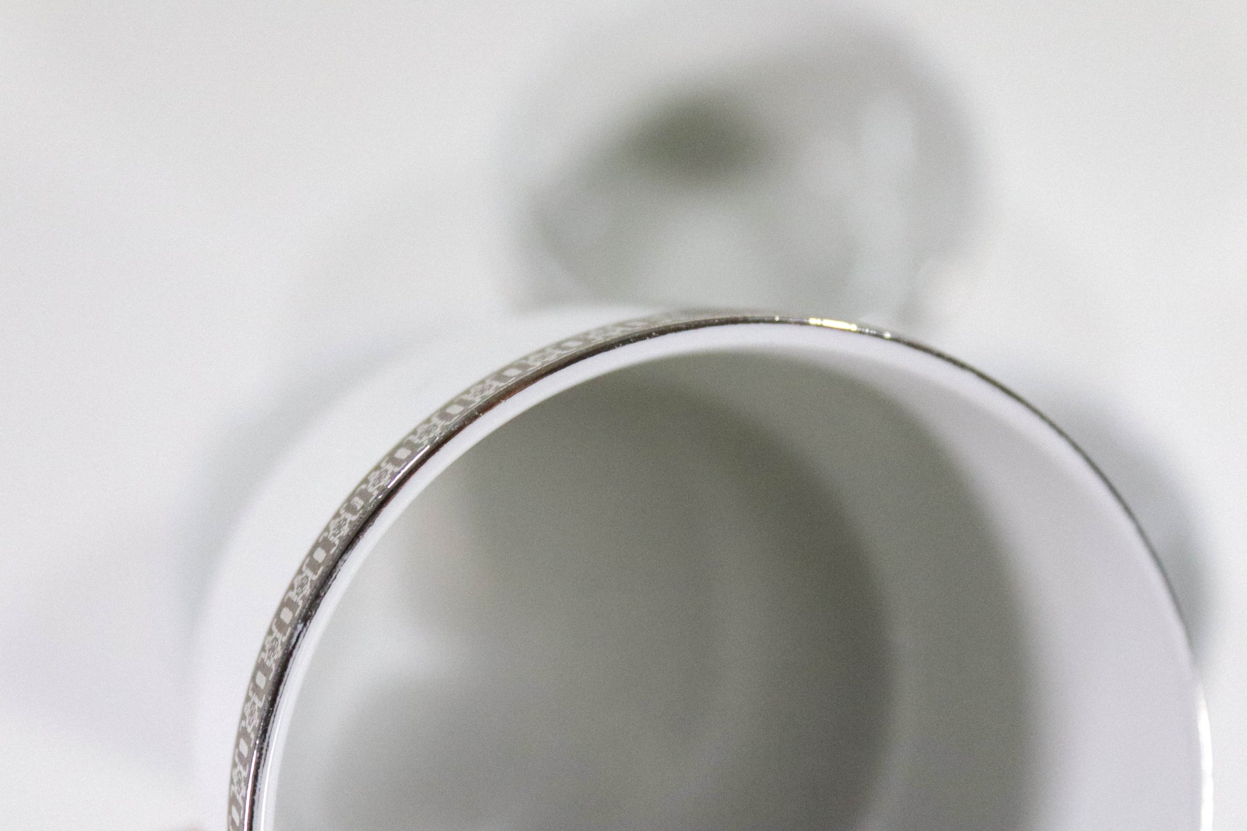 Set (4) of vintage Monopoli silver and porcelain cups.