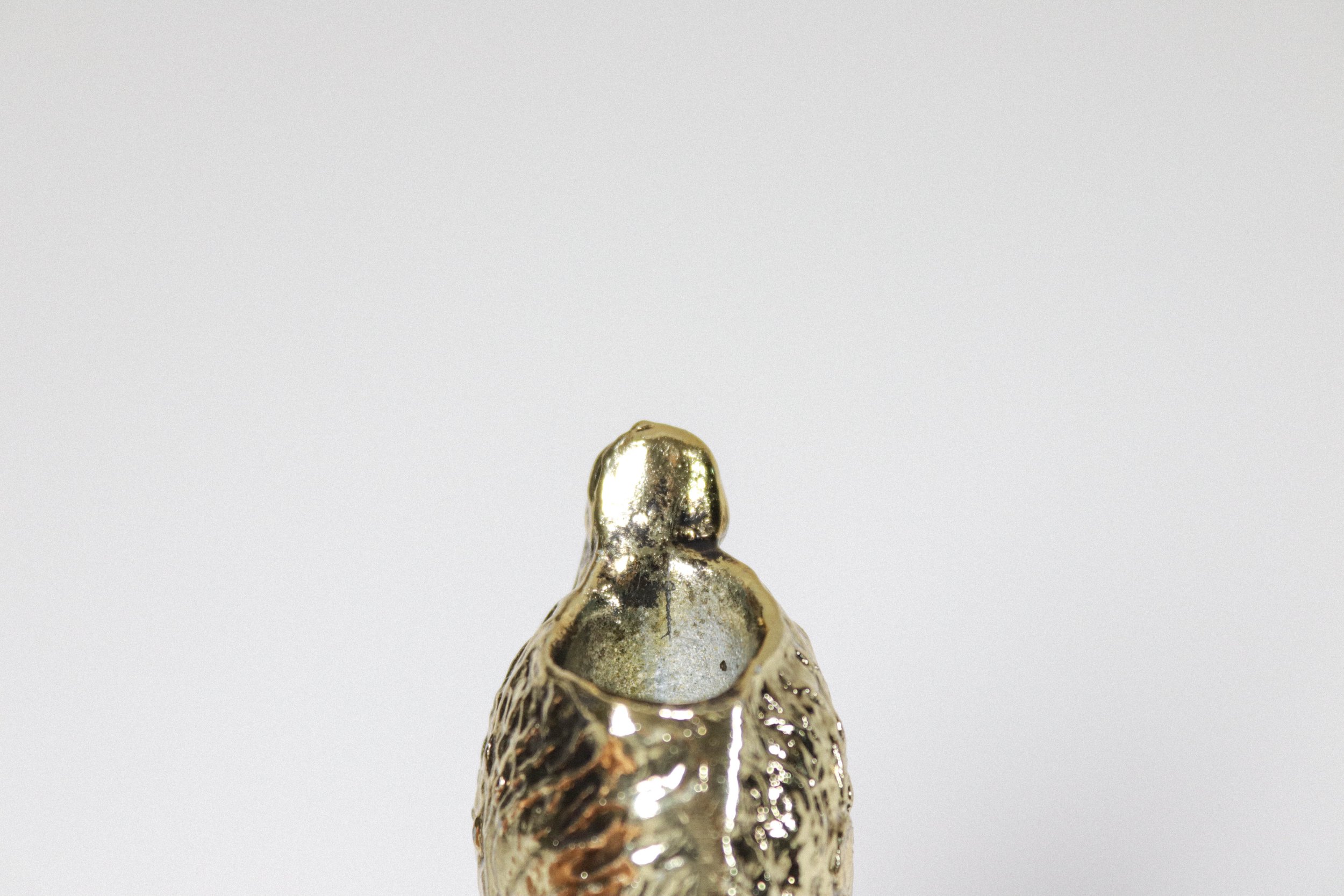 Vintage brass swan pen holder and paper weight with green eyes.