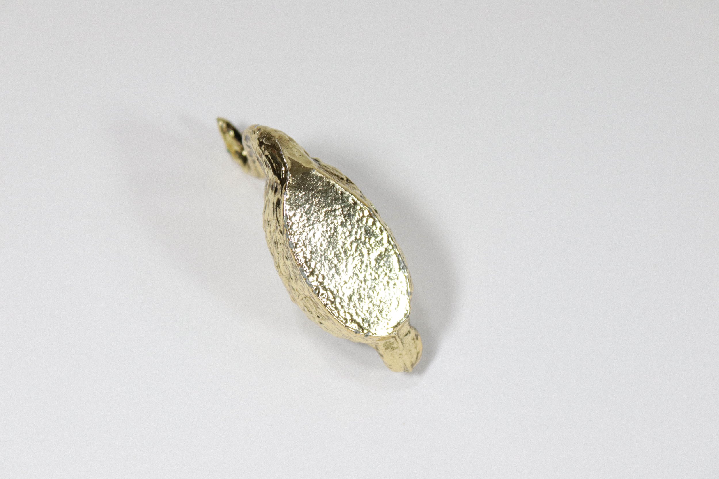 Vintage brass swan pen holder and paper weight with green eyes.