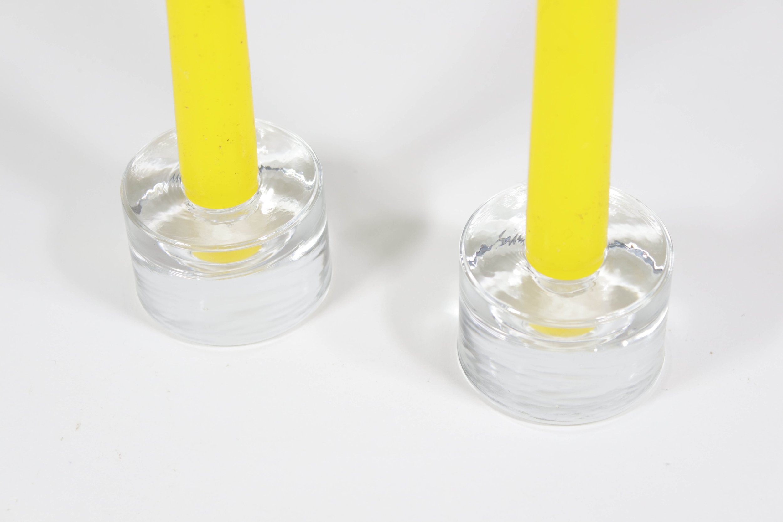 Set (2) of round clear glass candlestick holders.