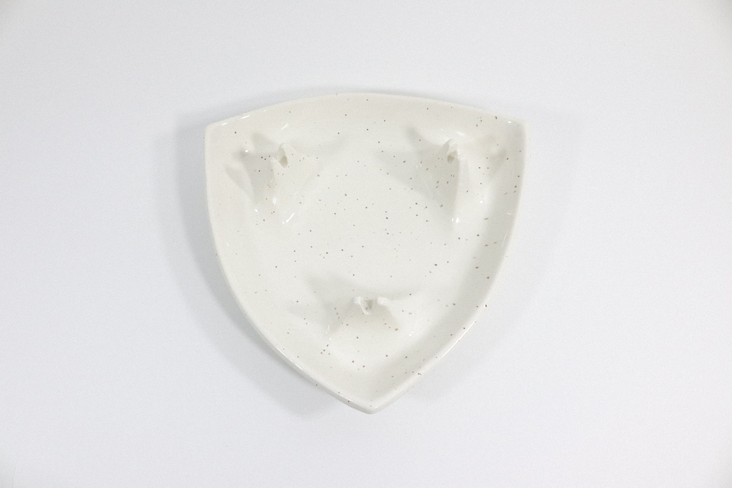 Vintage speckled triangle pottery ashtray. Made in California, USA.