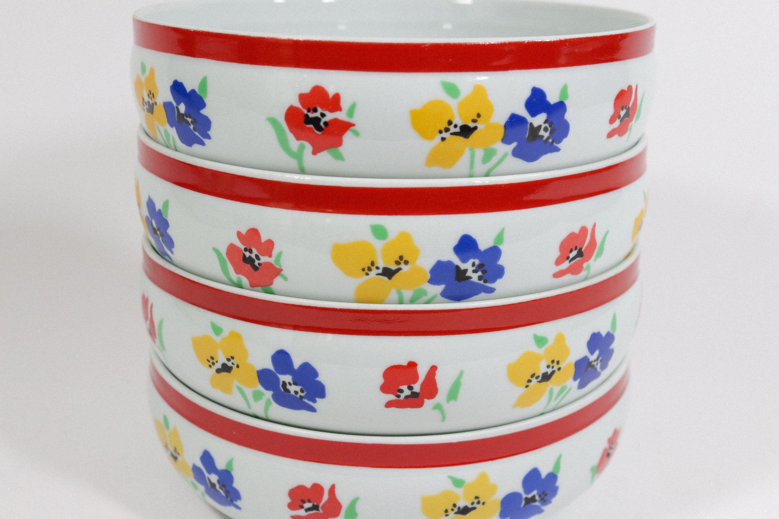 Vintage (1970s) Hearthstone Block Vista Alegre ceramic bowl set with blue, yellow, and red floral design. The set includes four soup bowls and one large serving bowl. Made in Portugal.