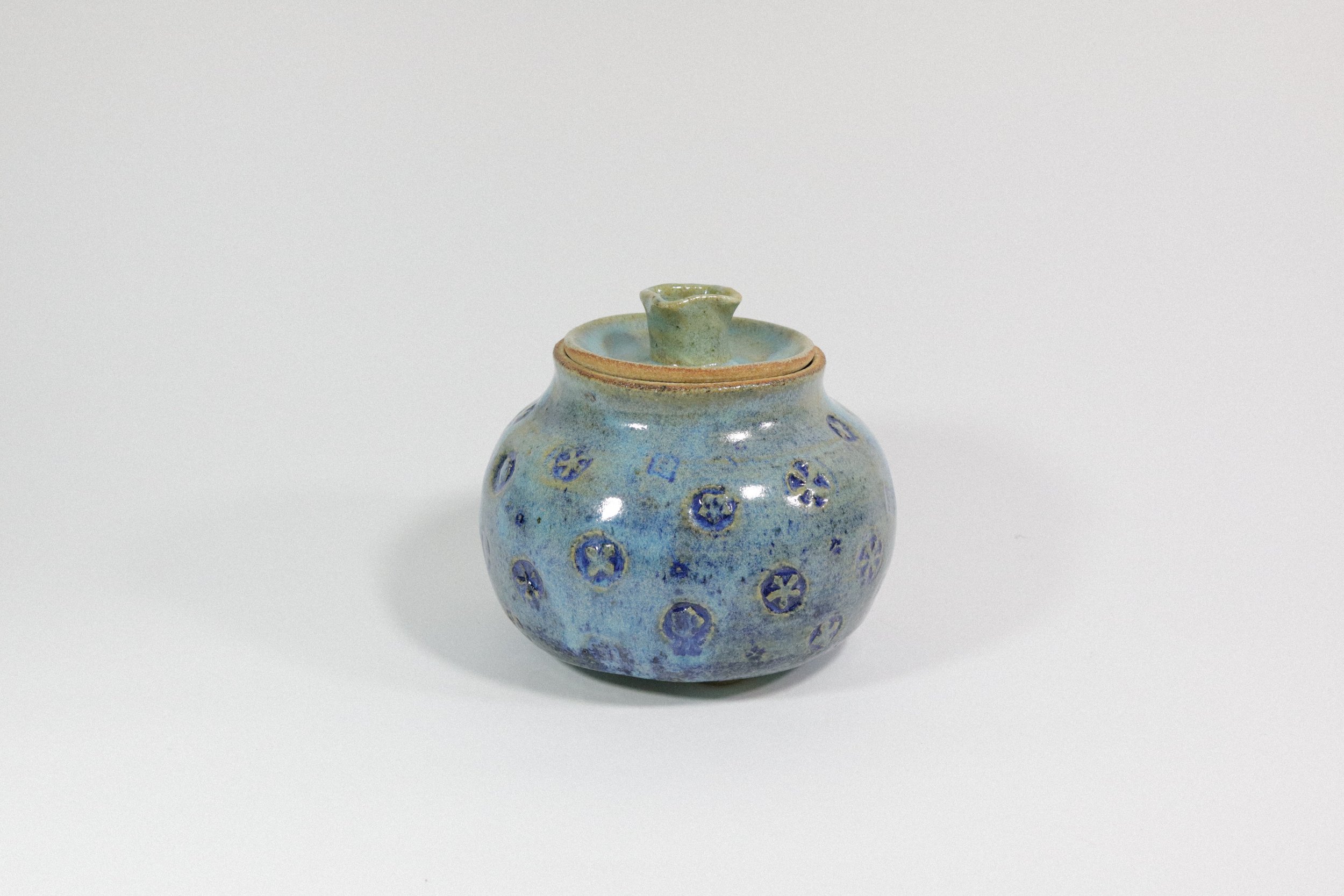 Handmade blue ceramic pottery jar with lid.