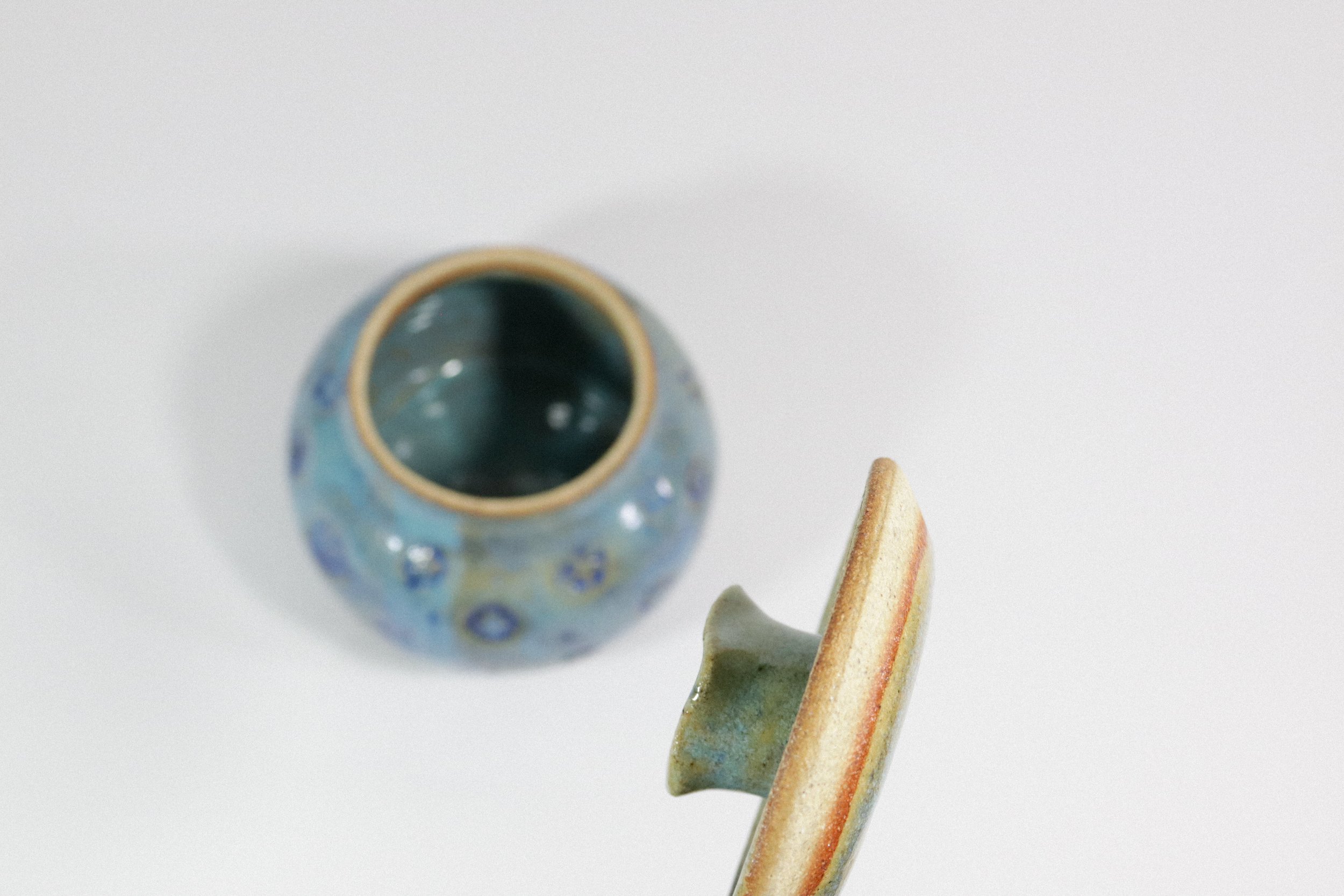 Handmade blue ceramic pottery jar with lid.