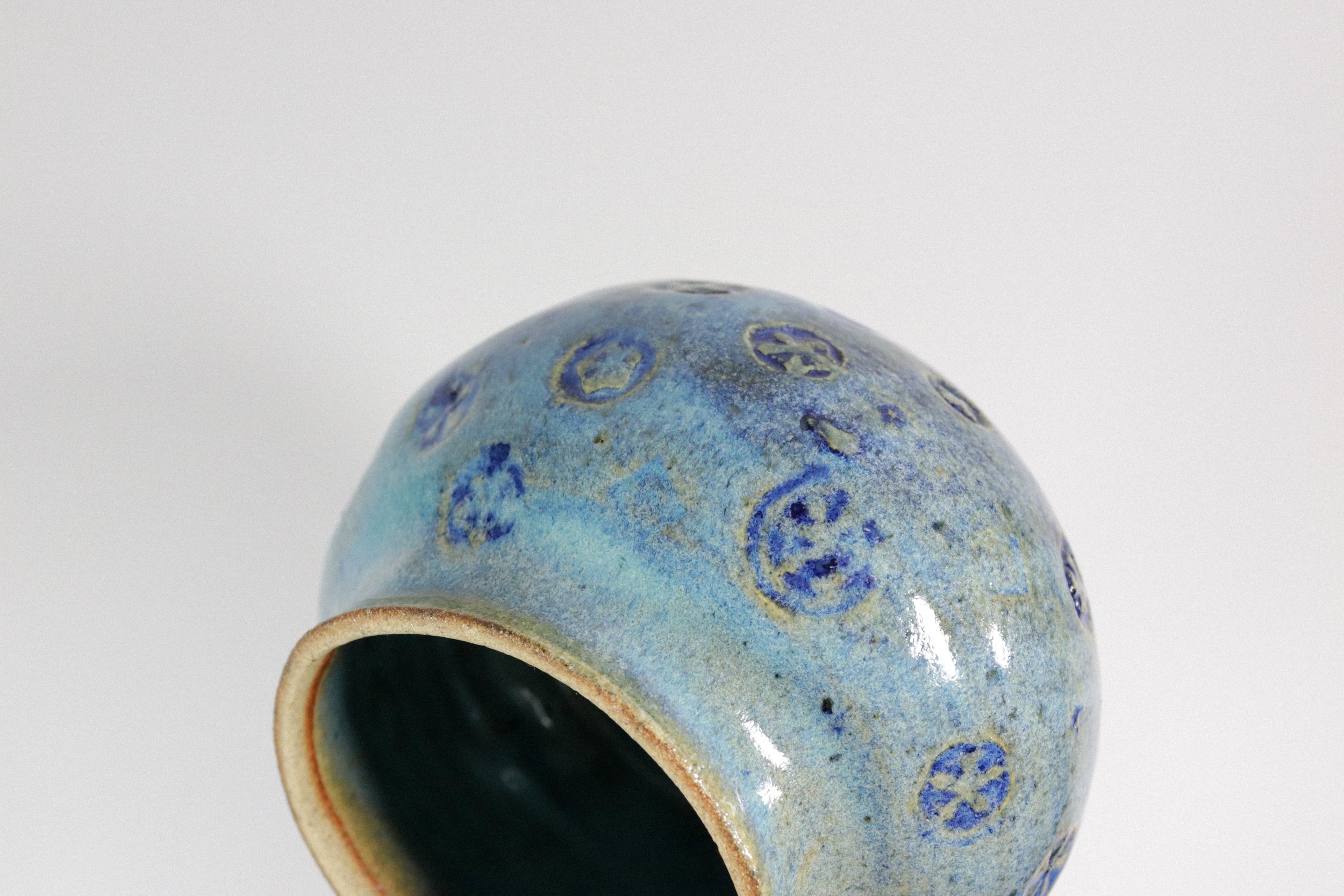 Handmade blue ceramic pottery jar with lid.