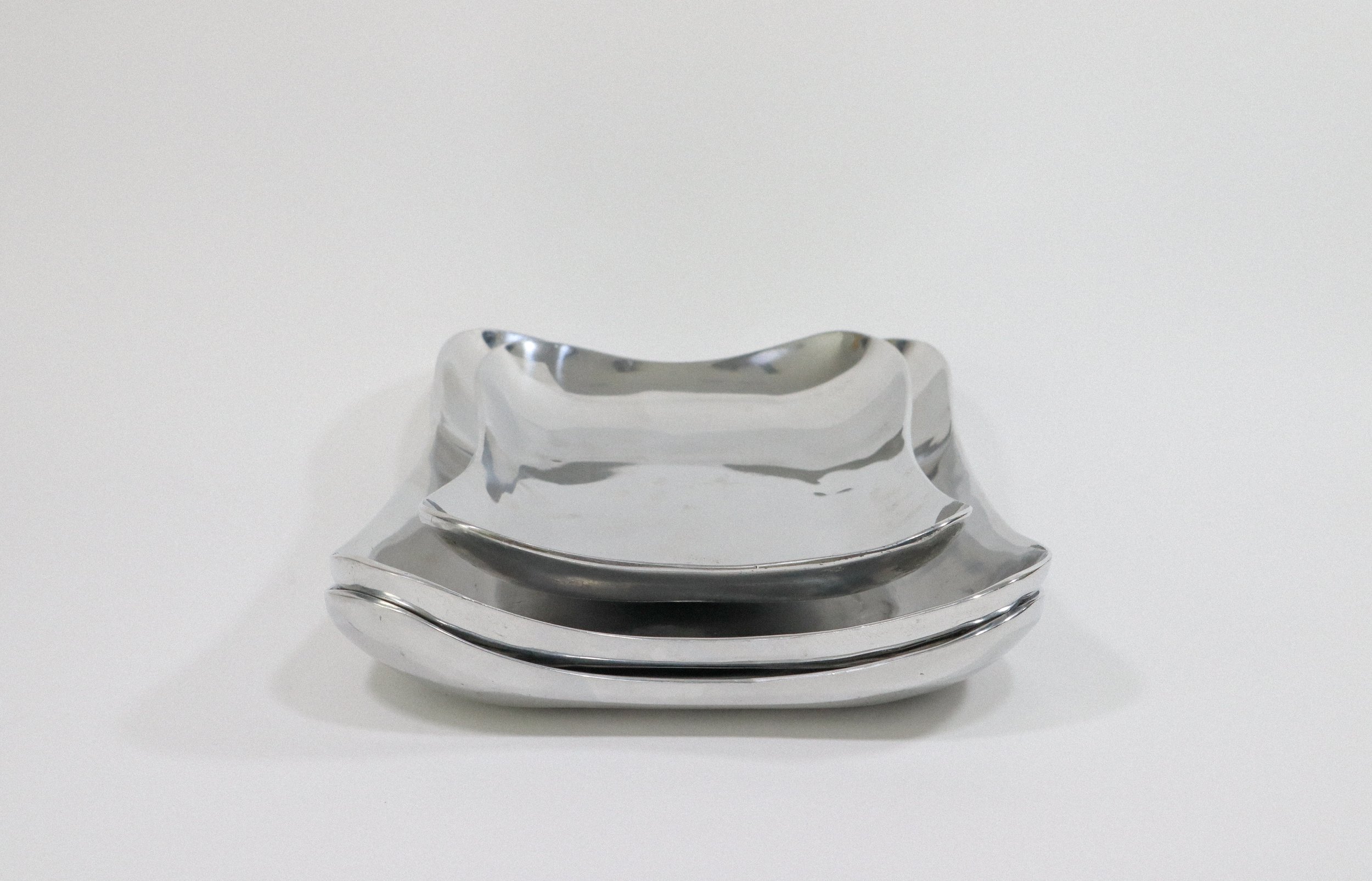 Set (3) of two large and one small Holland Boone Polished Pewter rounded rectangular trays.