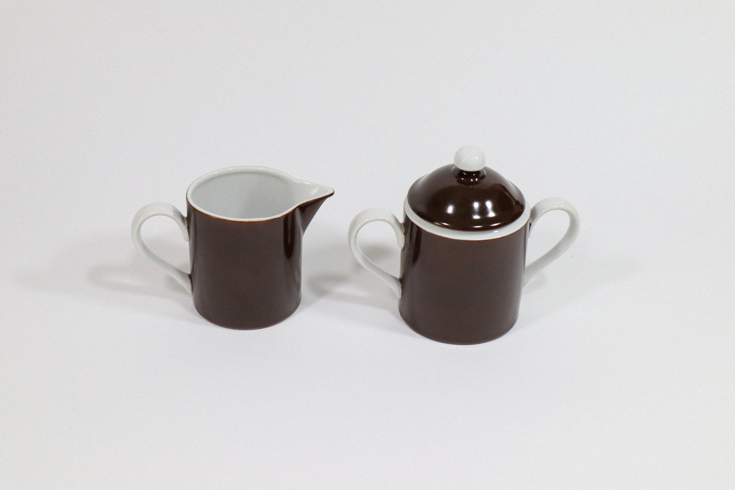 Vintage, circa 1975, Fitz & Floyd Rondelet porcelain coffee/tea set with 4 mugs, 1 creamer, and a sugar bowl with matching lid.