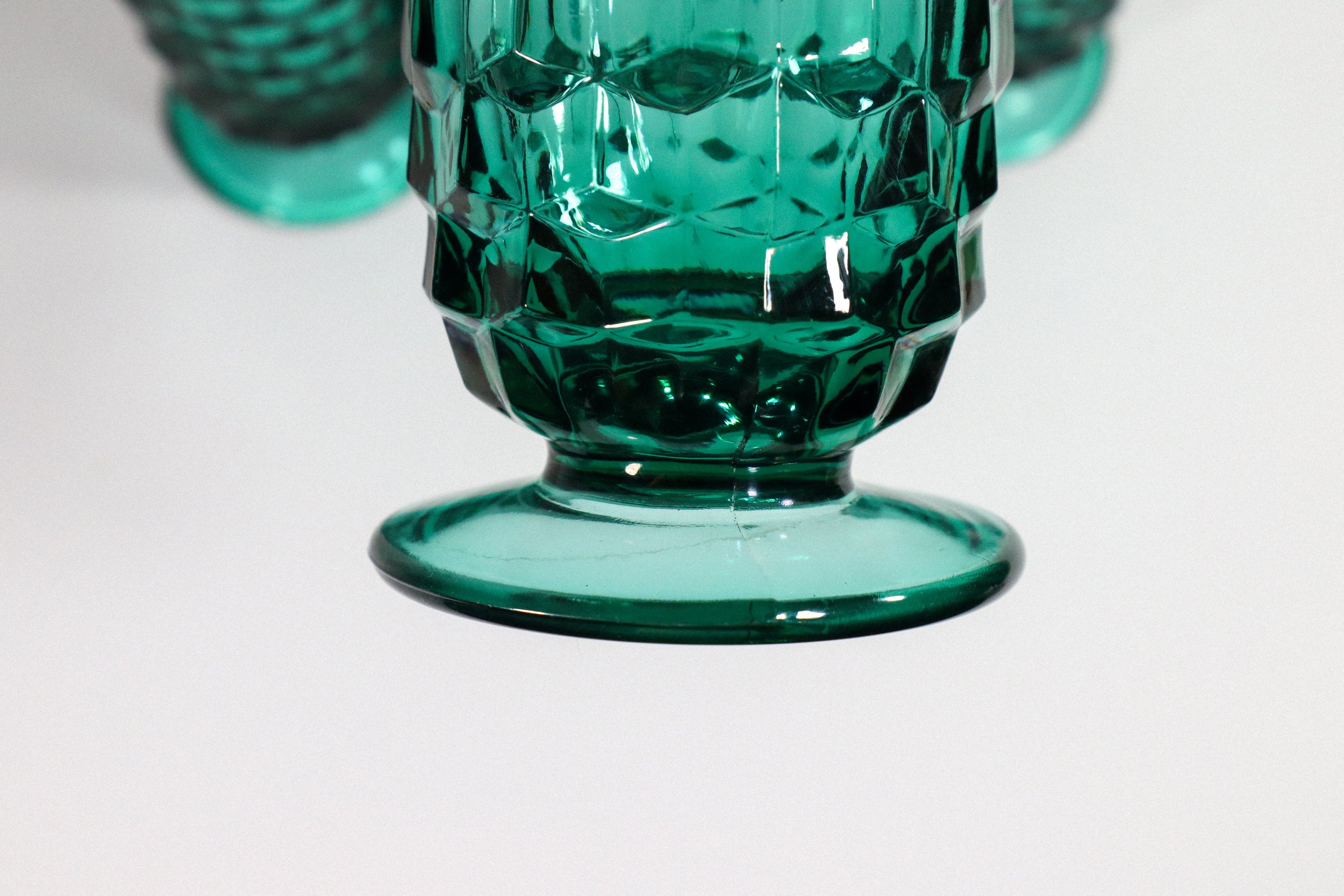 Set (4) of vintage, Indiana Whitehall cubist tall footed glasses in teal, a highly coveted colorway for this style of glassware.