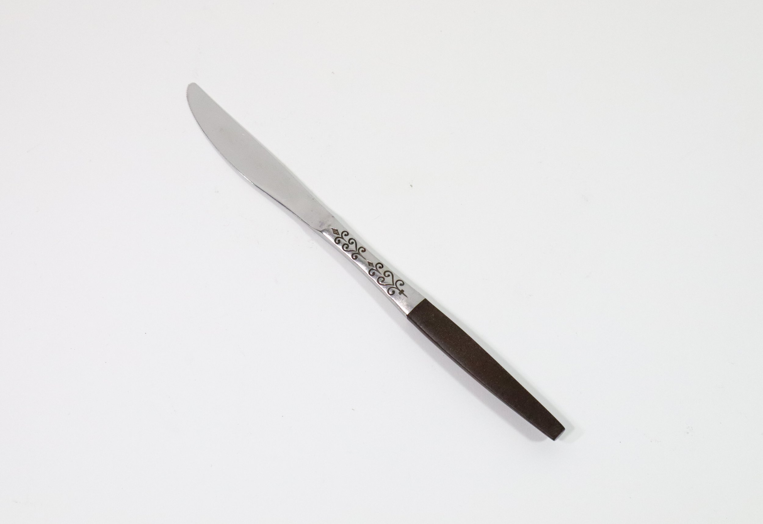 Vintage 1960s 36-piece Interpur Japan stainless steel and composite wood flatware set. Includes 8 dinner forks, 8 salad forks, 8 teaspoons, 2 tablespoons, and 10 knives.